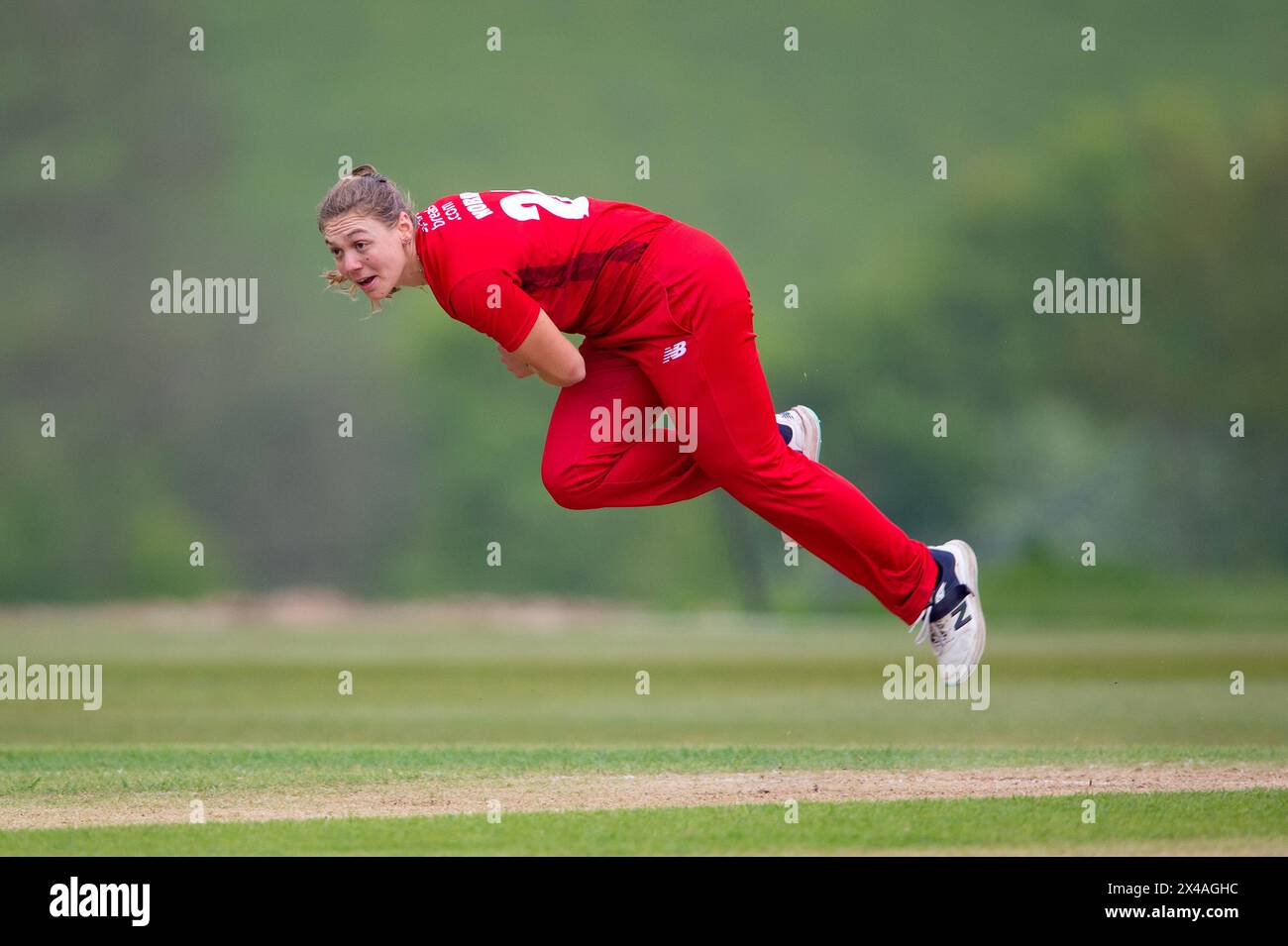 Stokenchurch, UK, 1st May 2024. Tara Norris of Thunder bowling during the Rachael Heyhoe Flint