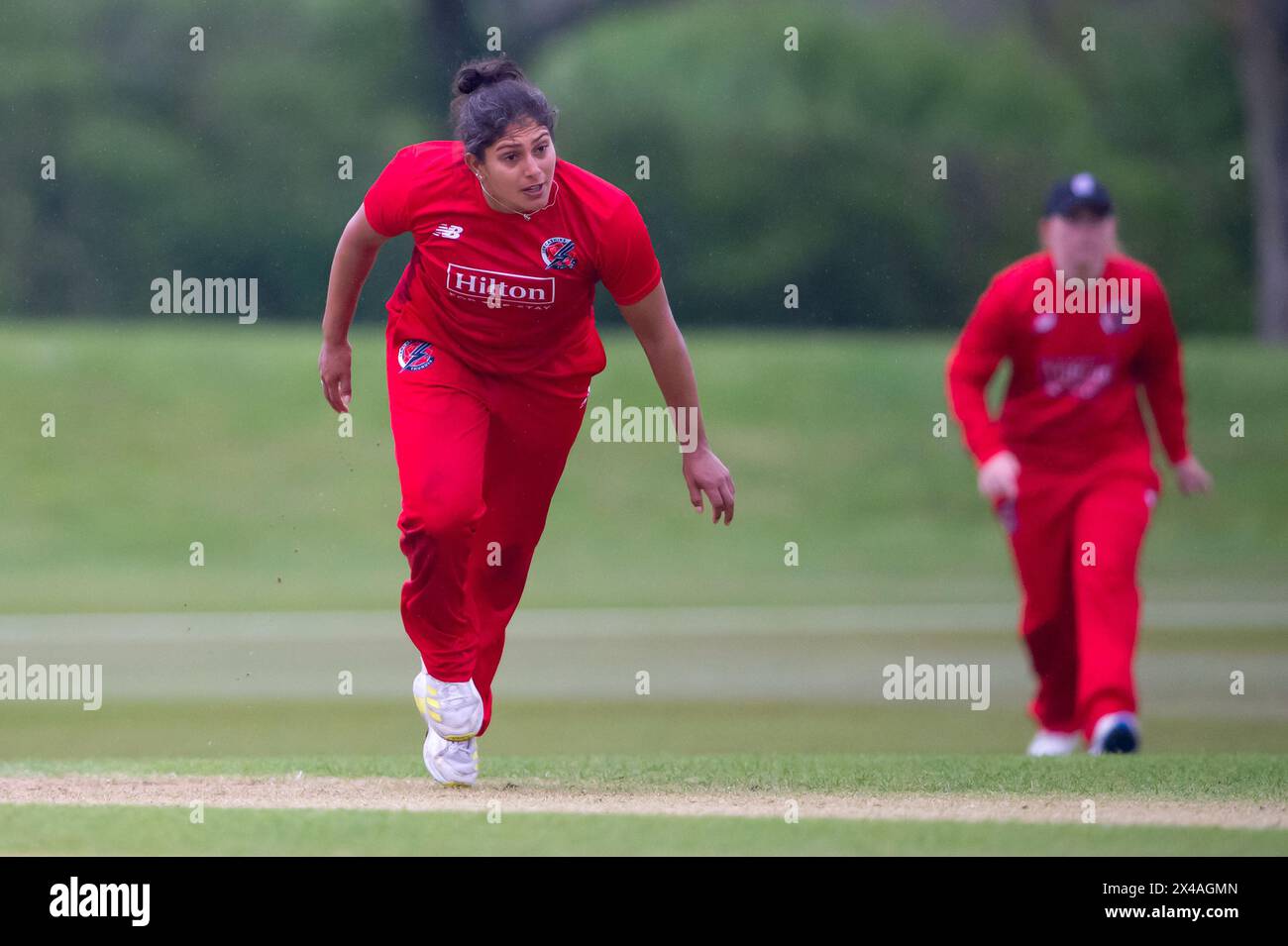 Stokenchurch, UK, 1st May 2024. Naomi Dattani of Thunder bowling during the Rachael Heyhoe Flint