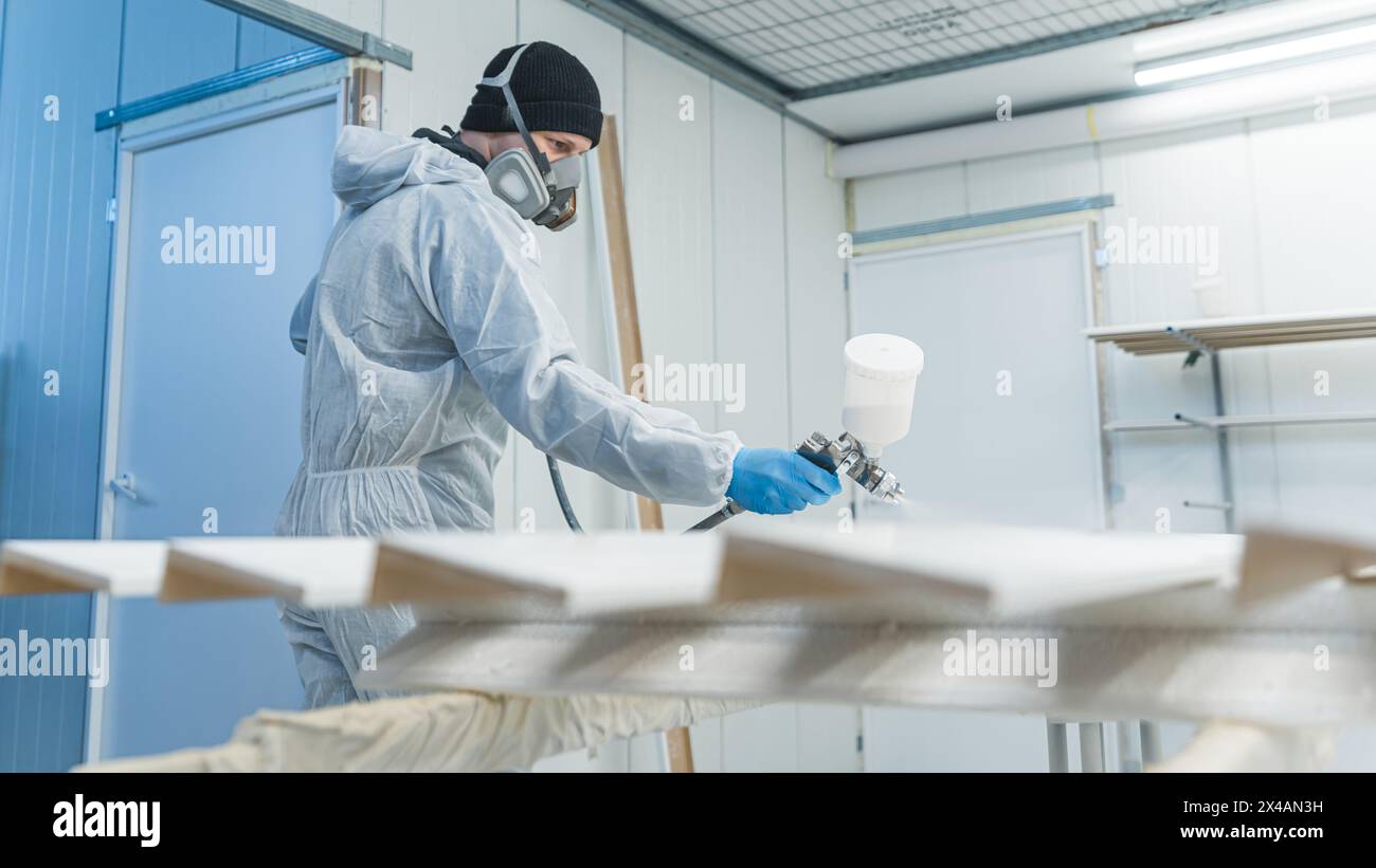 Men in paint spraying hi-res stock photography and images - Alamy