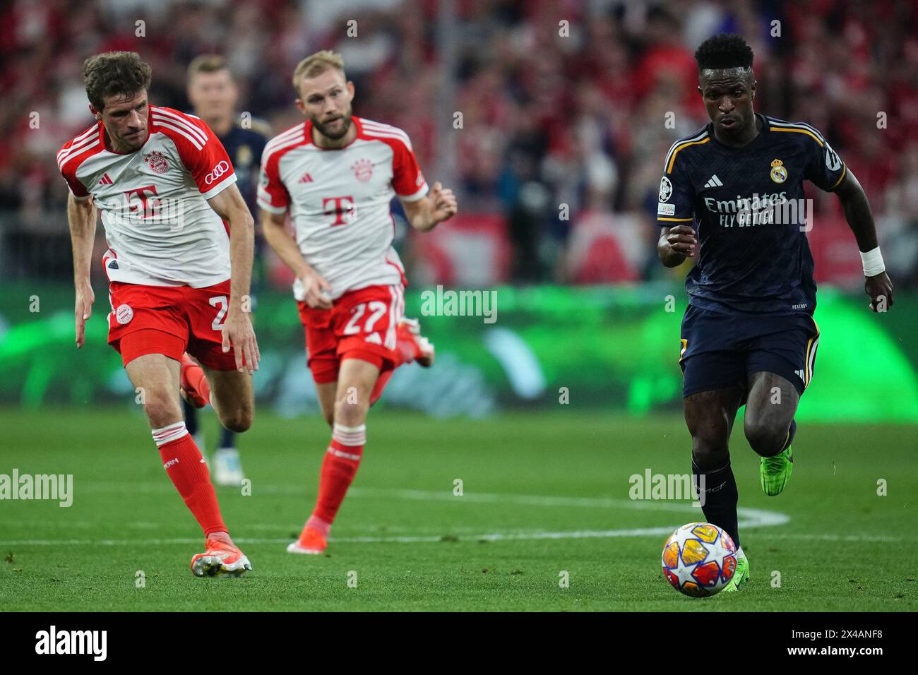 Munich, Germany. 30th Apr, 2024. Vinicius Junior of Real Madrid and Thomas Muller of Bayern Munchen during the UEFA Champions League match, Semi-finals, first leg, between FC Bayern Munchen and Real Madrid played at Allianz Stadium on April 30, 2024 in Munich, Germany. (Photo by Bagu Blanco/PRESSINPHOTO) Credit: PRESSINPHOTO SPORTS AGENCY/Alamy Live News Stock Photo
