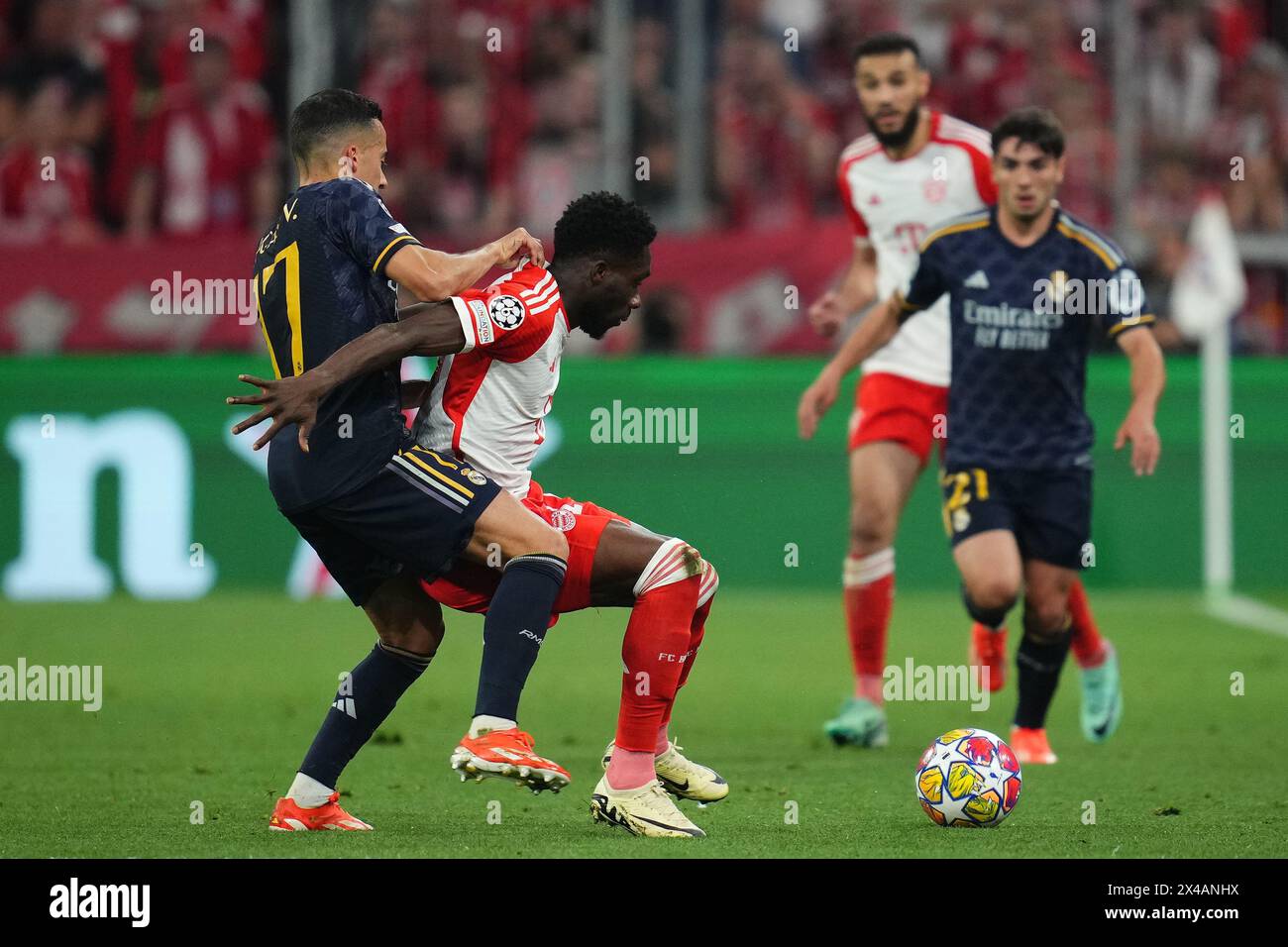 Munich, Germany. 30th Apr, 2024. Lucas Vazquez of Real Madrid and Alphonso Davies of Bayern Munchen during the UEFA Champions League match, Semi-finals, first leg, between FC Bayern Munchen and Real Madrid played at Allianz Stadium on April 30, 2024 in Munich, Germany. (Photo by Bagu Blanco/PRESSINPHOTO) Credit: PRESSINPHOTO SPORTS AGENCY/Alamy Live News Stock Photo