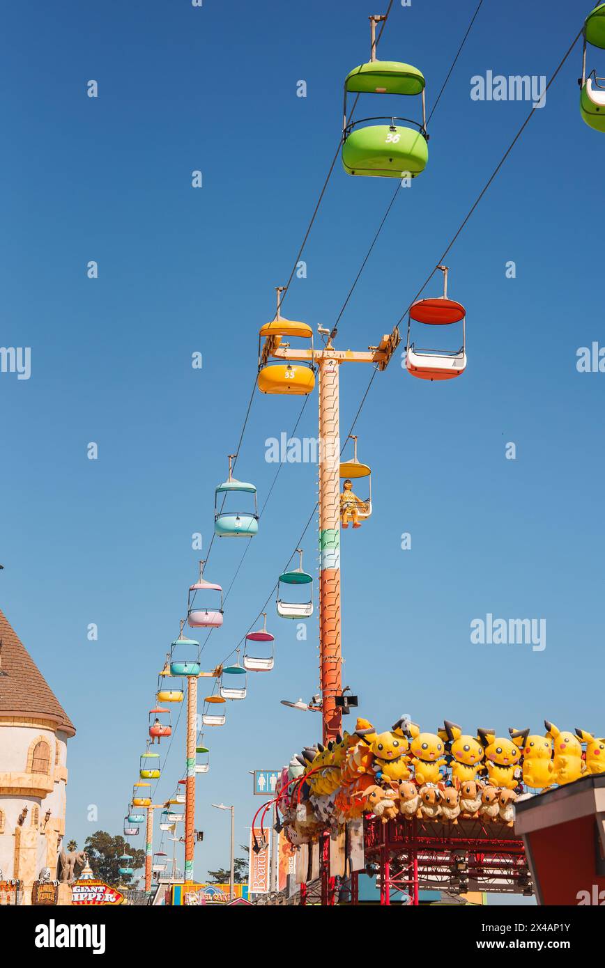 Colorful Sky Ride with Pikachu and Castle Turret in Fairground Setting Stock Photo