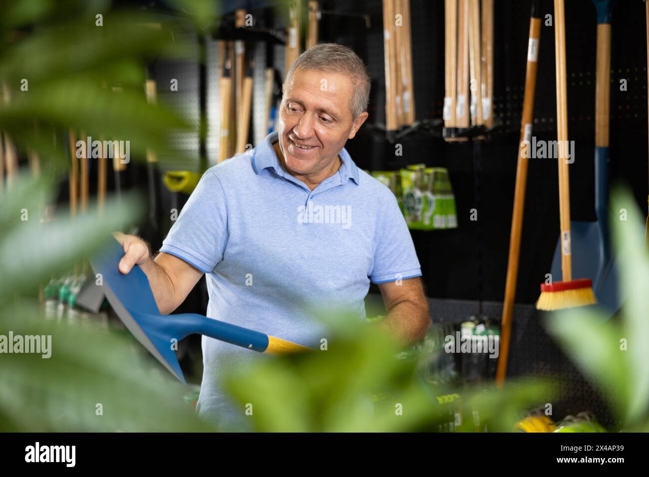 Man holding spade hi-res stock photography and images - Alamy
