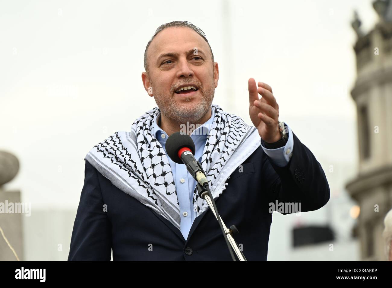 TRAFALGAR SQUARE, LONDON, UK. 1st May, 2024. Speaker Dr. Husam Zomlot is a Palestinian Ambassador in the UK. He is speaking at the rally against genocide in Gaza, Palestine. The UK government must stop selling arms to Israel. Credit: See Li/Picture Capital/Alamy Live News Stock Photo