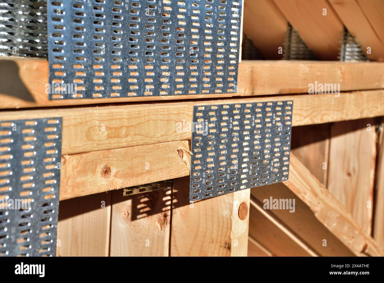 Hot dipped galvanized connector plates for wood structure truss and joist. Stock Photo