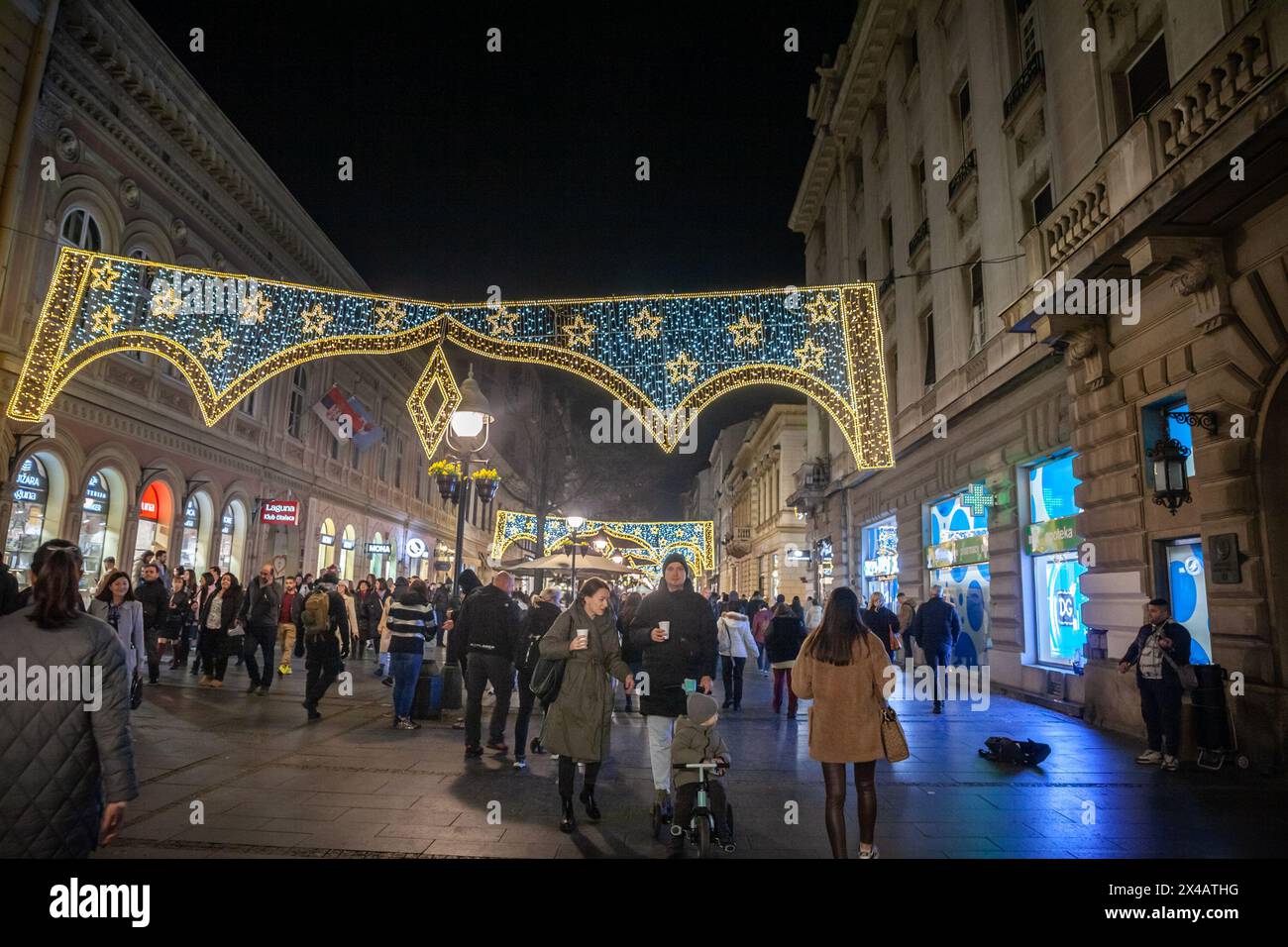 Picture of the Belgrade Christmas decorations on the Kneza Mihailova (knez mihailo) street at night with a crowd of pedestrians walking, in Belgrade, Stock Photo