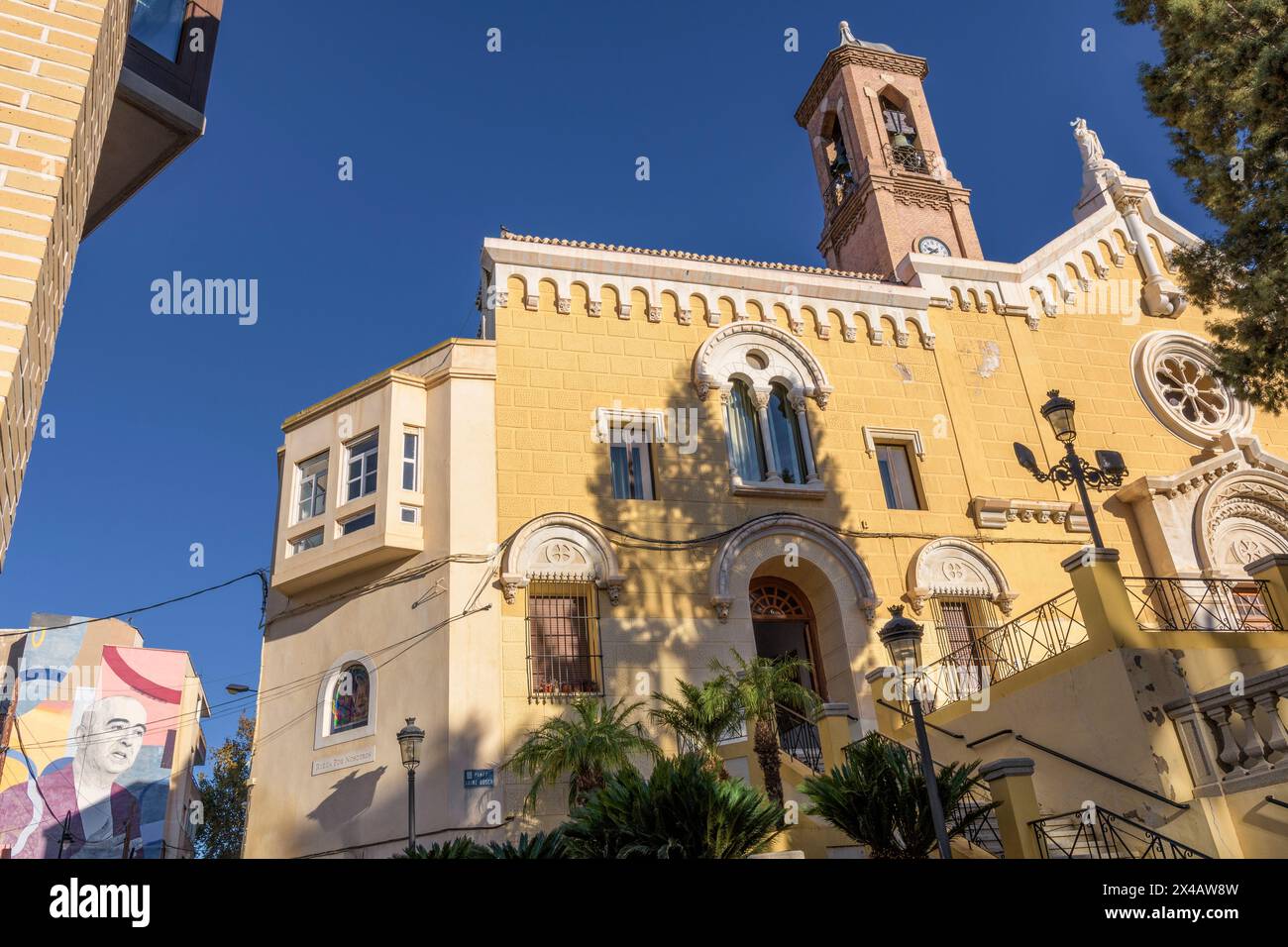 Church of the Sacred Heart of Jesus in the Plaza de Jaime Bosch with the fountain and the bronze bust on a pedestal of the poet Monroy, Cartagena. Stock Photo