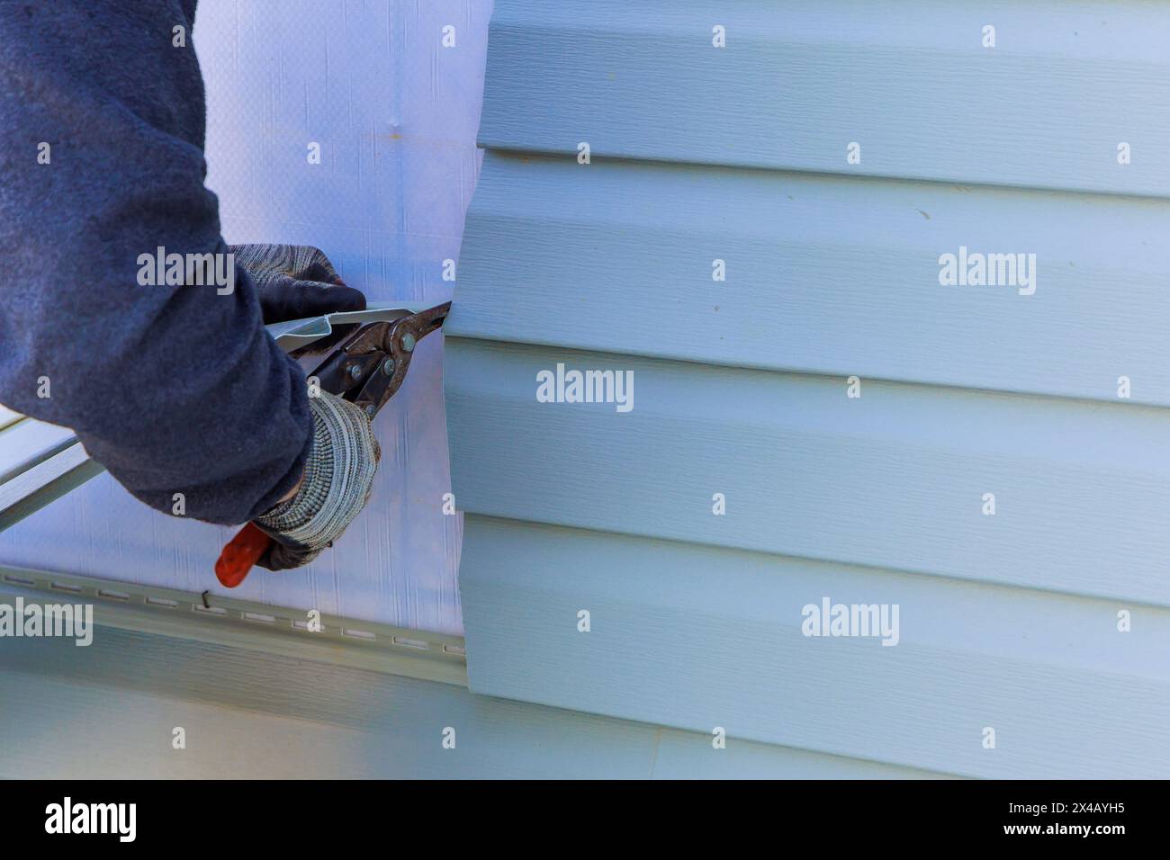 House exterior plastic siding was process replacement on exterior wall