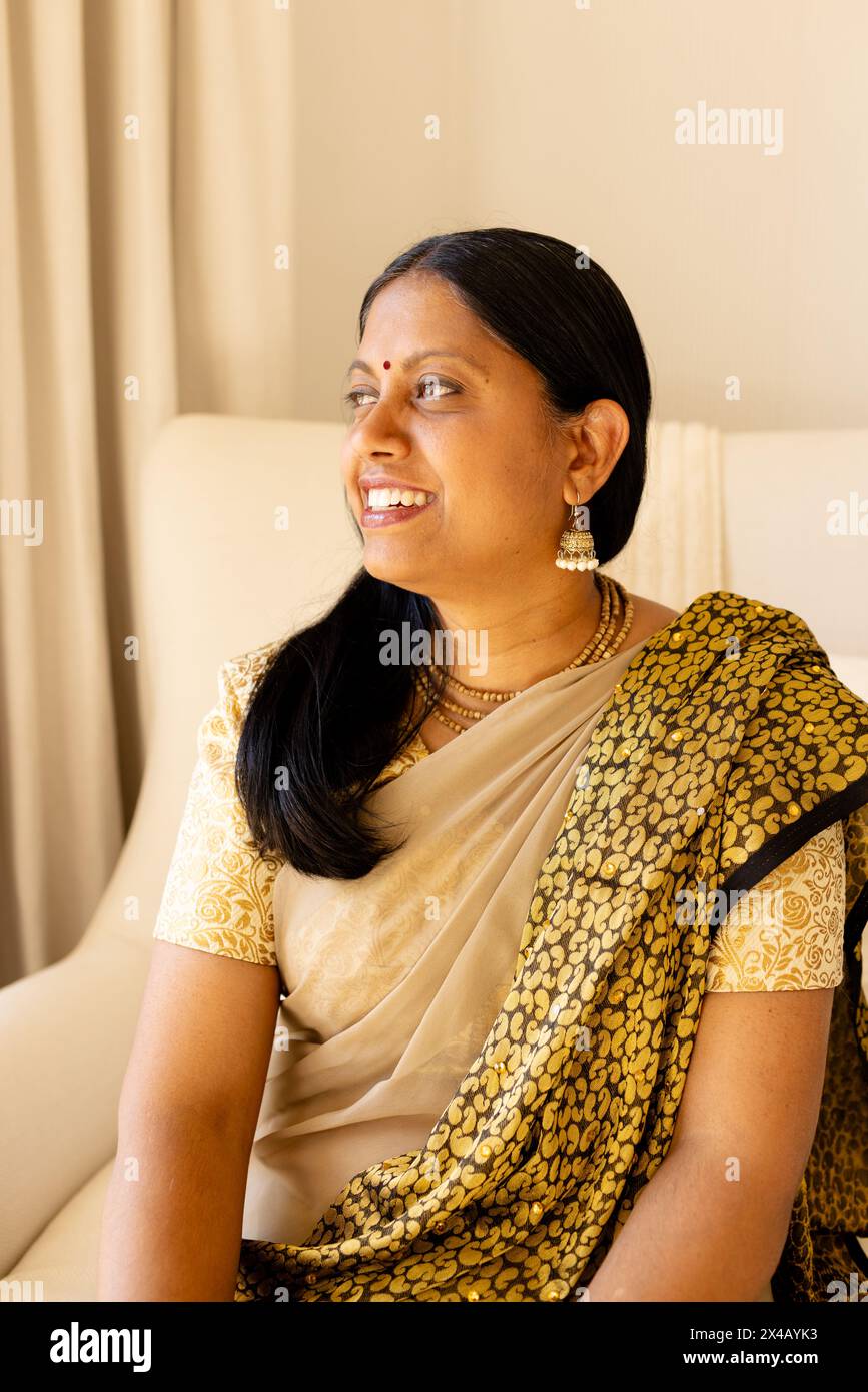 Indian woman wearing gold earrings hi-res stock photography and images ...