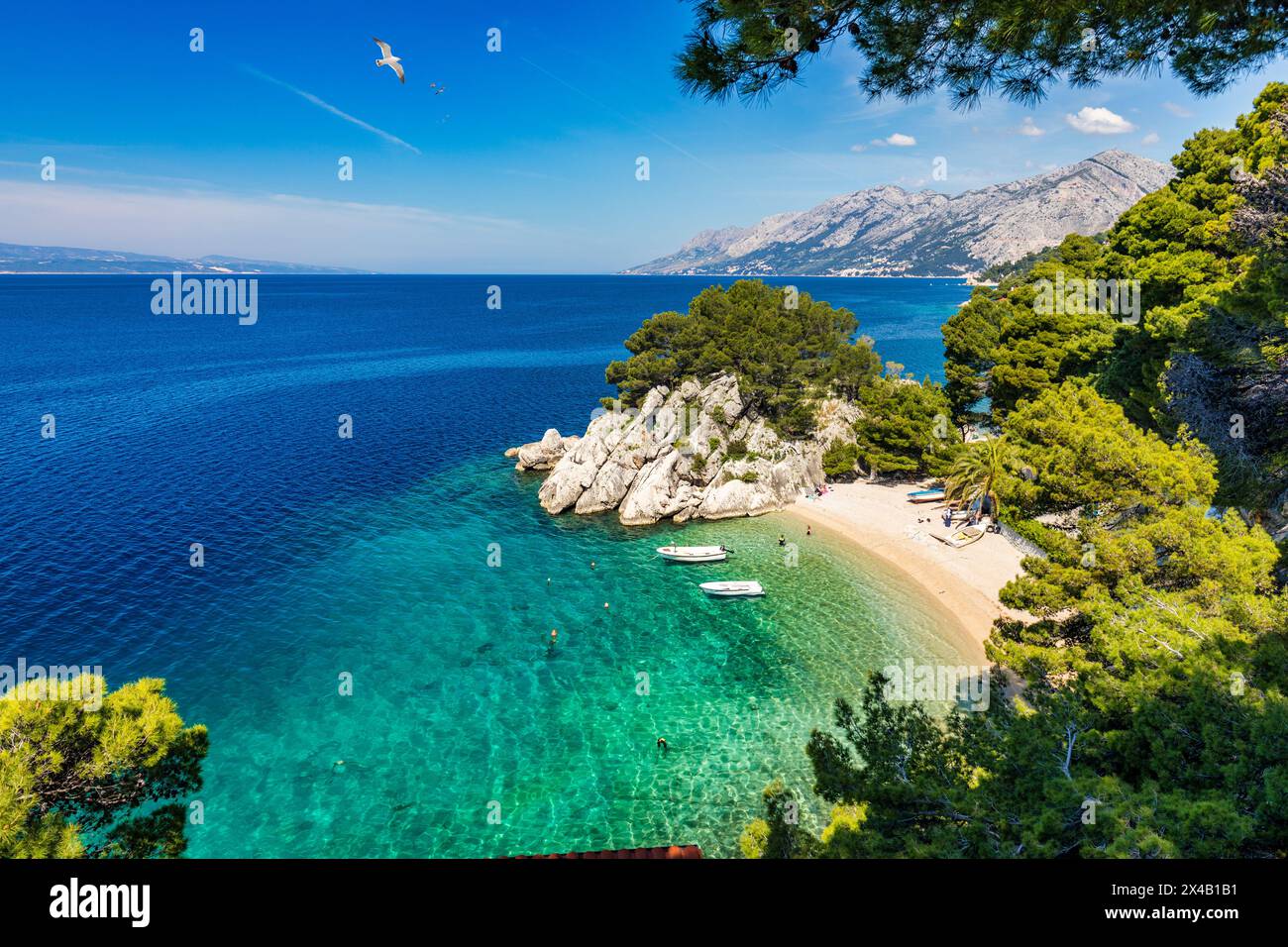 Amazing aerial view of the beautiful Podrace beach in Brela, Makarska Riviera, Croatia. Aerial view of Podrace beach and waterfront on Makarska rivier Stock Photo