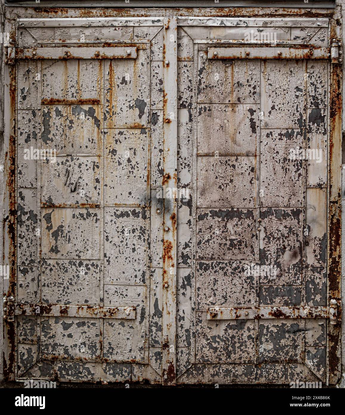 Paint peeling off a old delapidated Door.  good background image Stock Photo