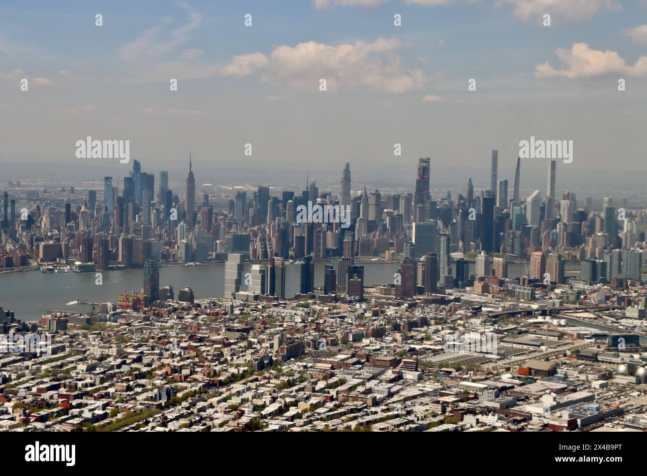 Aerial view of Long Island City with midtown Manhattan in the ...
