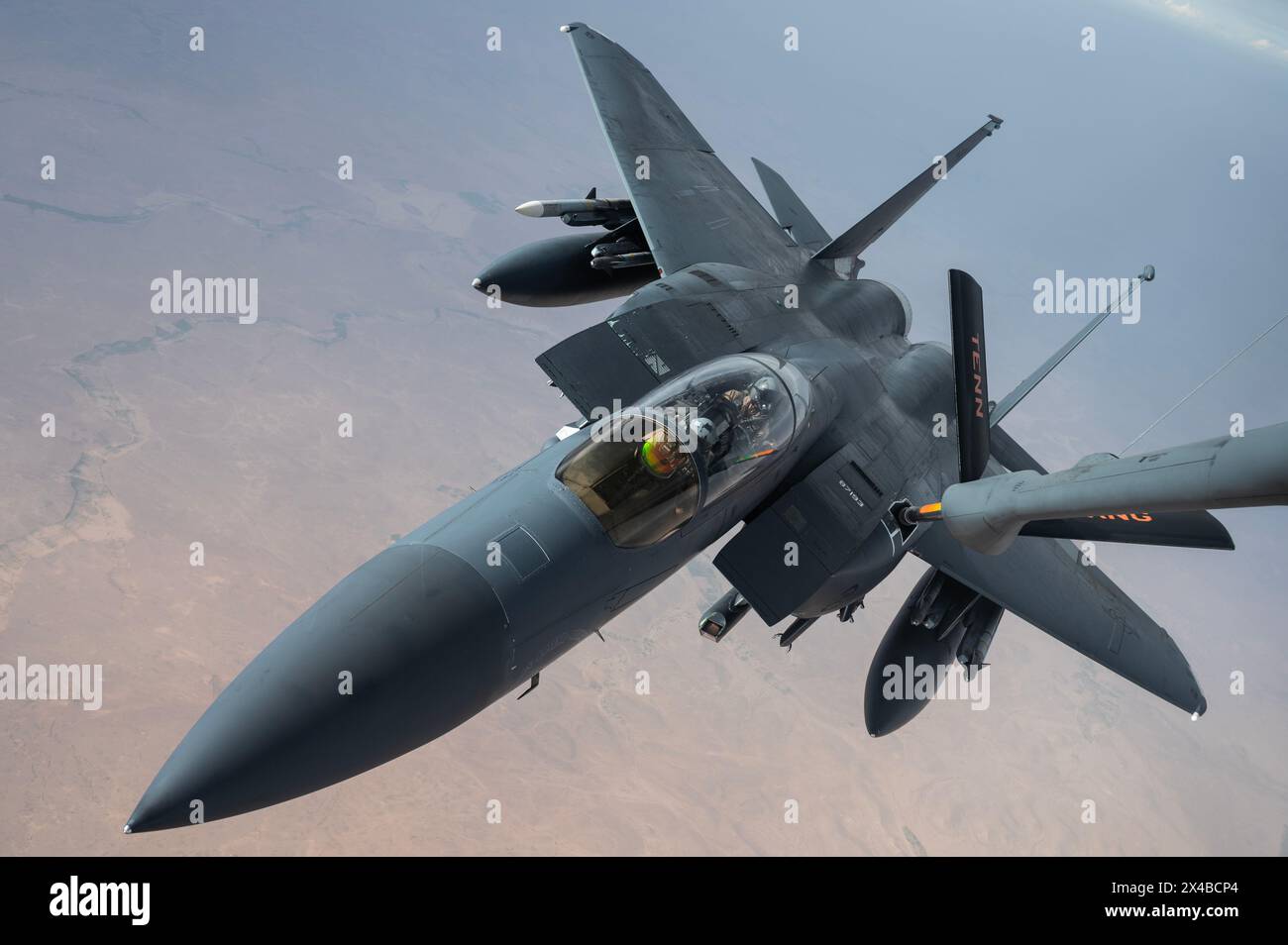 A U.S. Air Force F-15E Strike Eagle from Seymour-Johnson Air Force BaseÕs 335th Fighter Squadron receives fuel from a KC-135 Stratotanker from the Ten Stock Photo