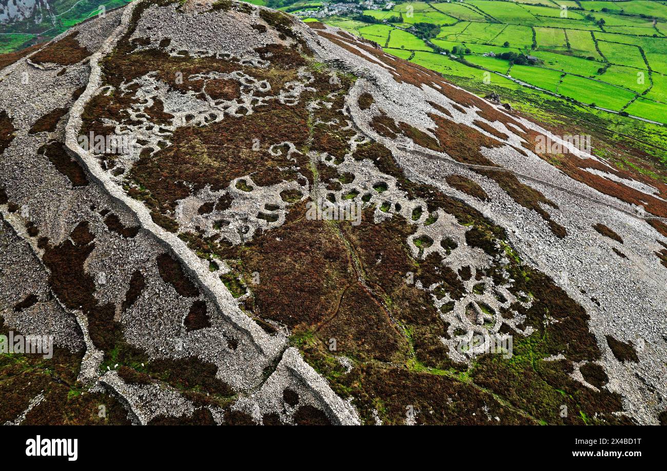 Tre’r Ceiri Iron Age settlement hillfort on Llyn Peninsula, north Wales. 200 BC through 400 AD. Massive 4m walls and stone hut circles. Looking E.N.E. Stock Photo