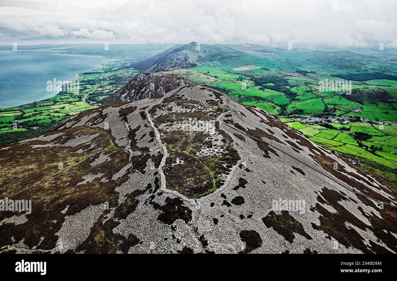 Tre’r Ceiri Iron Age settlement hillfort on Llyn Peninsula, north Wales. 200 BC through 400 AD. Massive 4m walls and stone hut circles. Looking N.E. Stock Photo