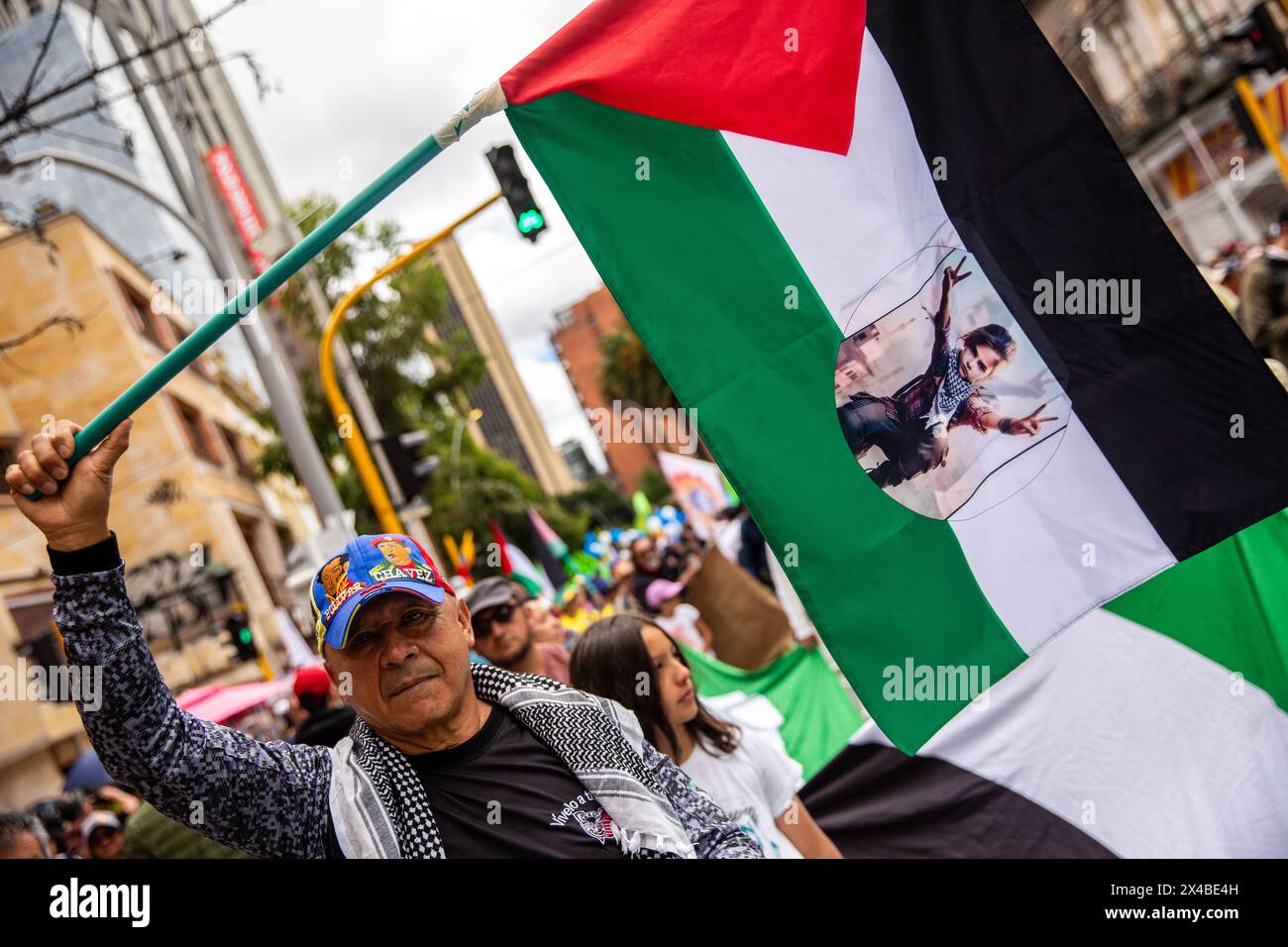 Demostrators carry Palestinian banner during march Massive May Day march in Bogotá, where Colombian President Gustavo Petro declared the end of diplomatic relations with Israel. (Photo by Antonio Cascio/SOPA Images/Sipa USA) Credit: Sipa USA/Alamy Live News Stock Photo