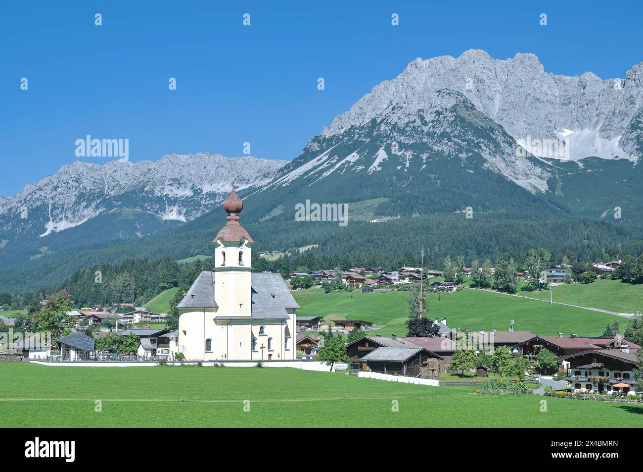 popular idyllic Village of Going am Wilden Kaiser with Kaisergebirge Mountains in Background,Tirol,Austria Stock Photo