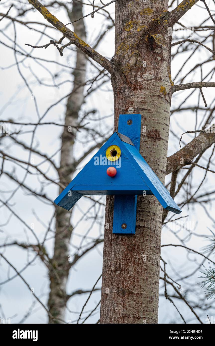Bird house on tree trunk Kumla Sweden April 29 2024 Stock Photo