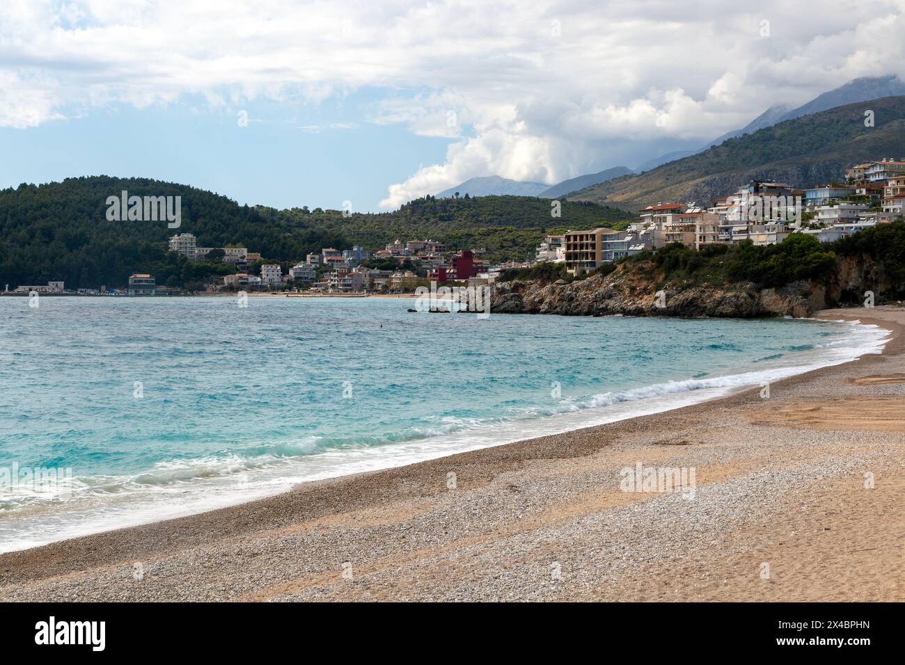 View north towards town and mountains from Prinos beach, Himare, Albanian Riviera, Albania Stock Photo