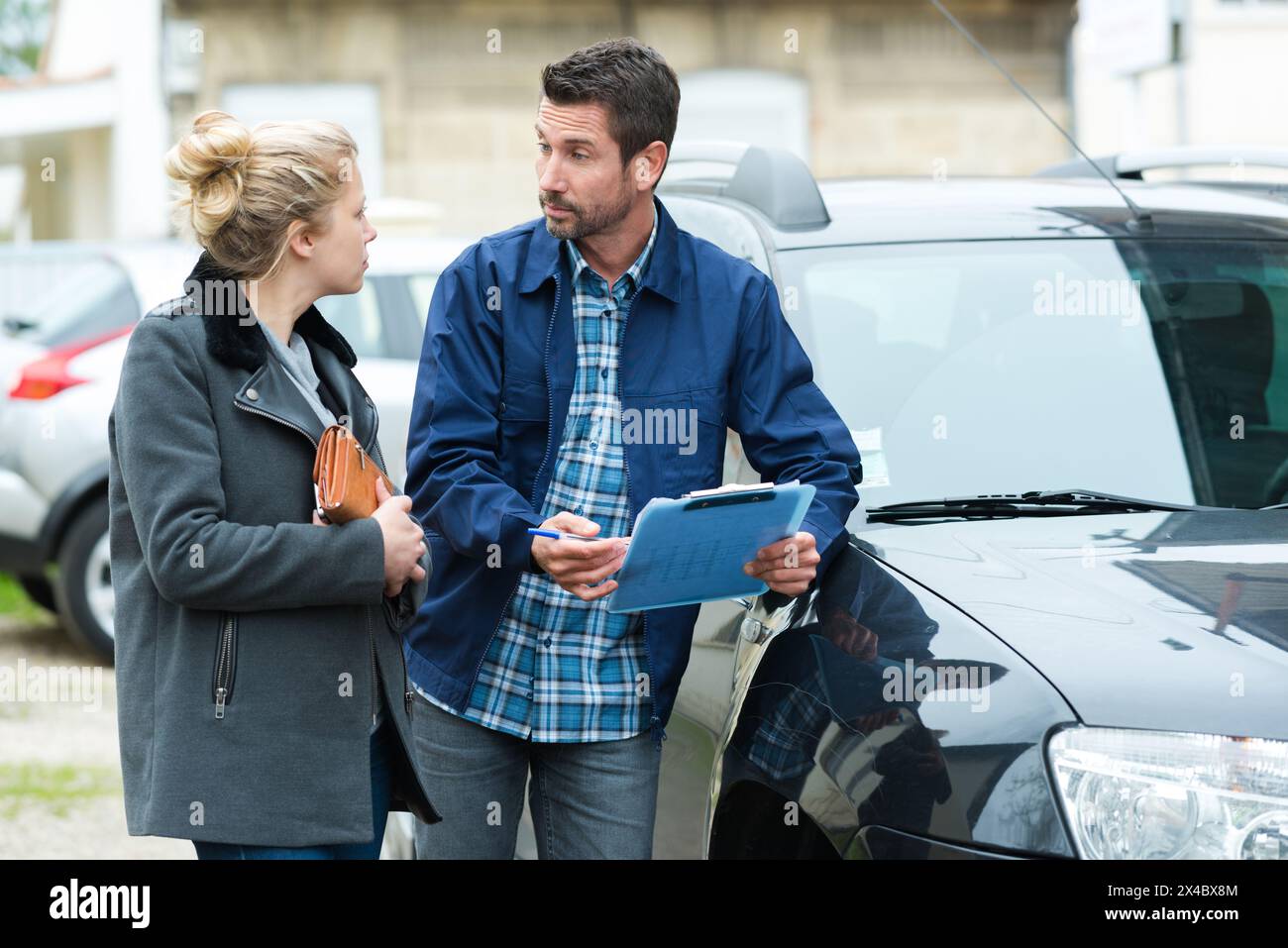 Insurance discussion mechanic client hi-res stock photography and ...