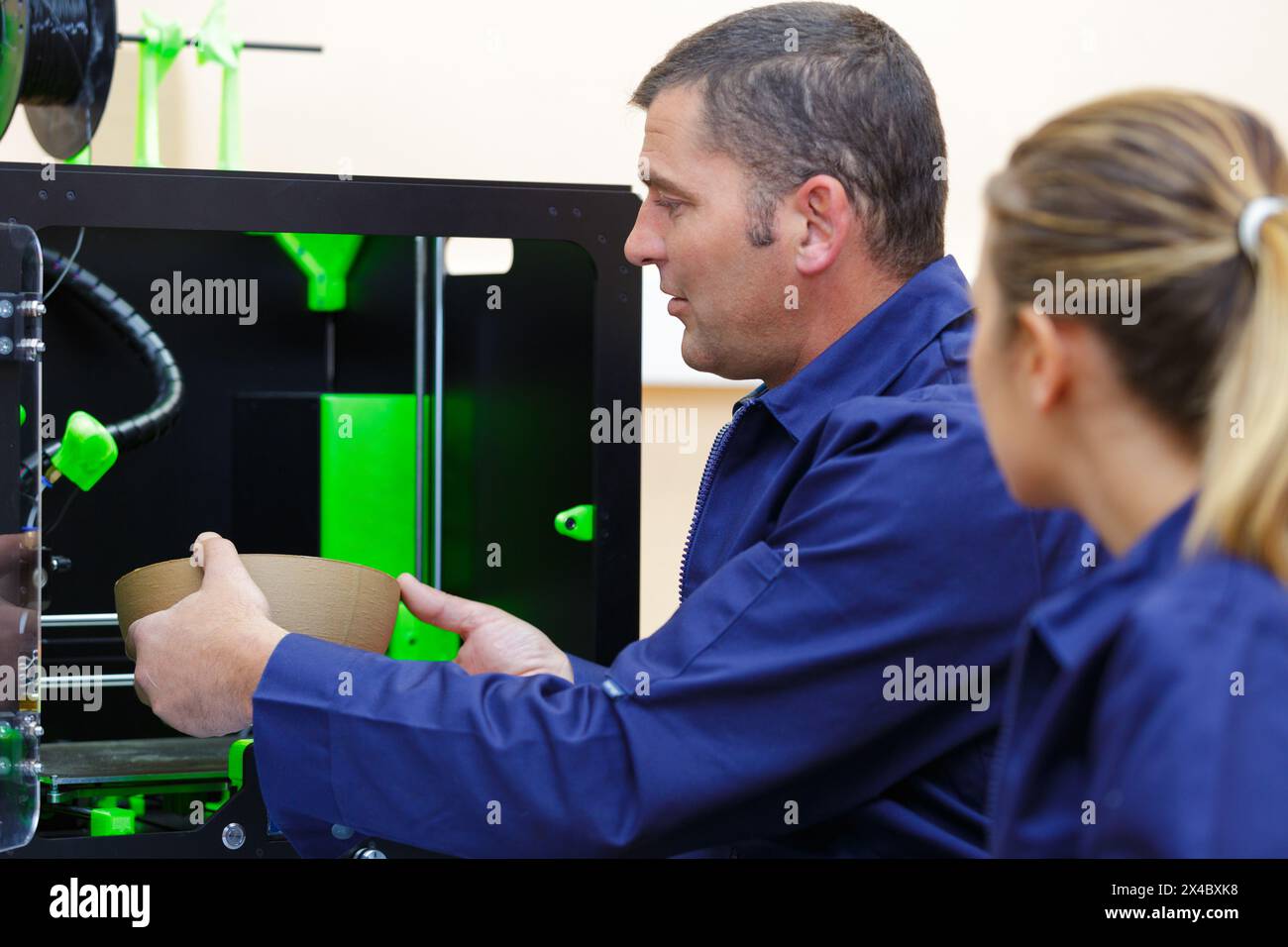 3d printer workers in factory Stock Photo