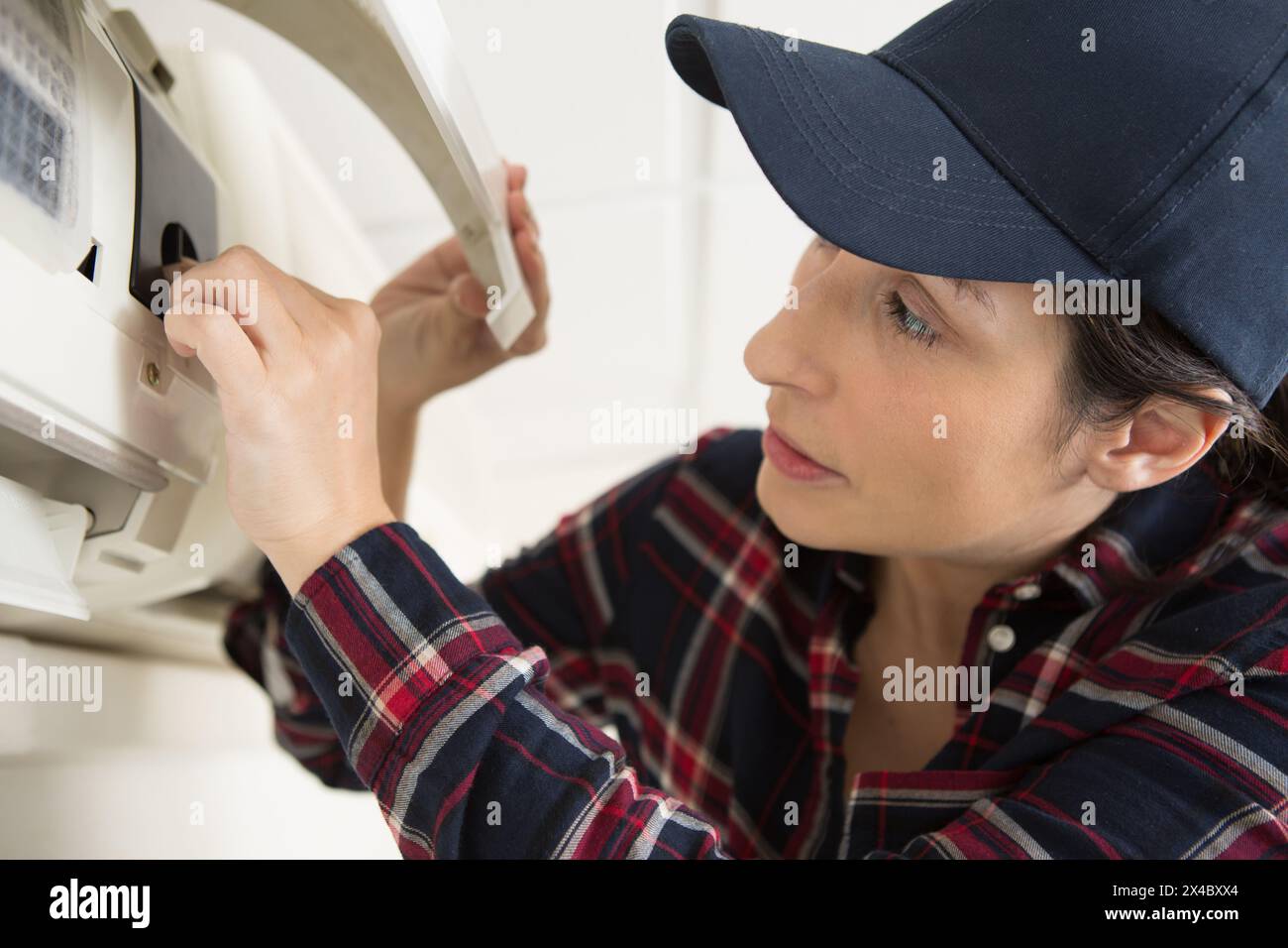 female technician fixing a printer Stock Photo