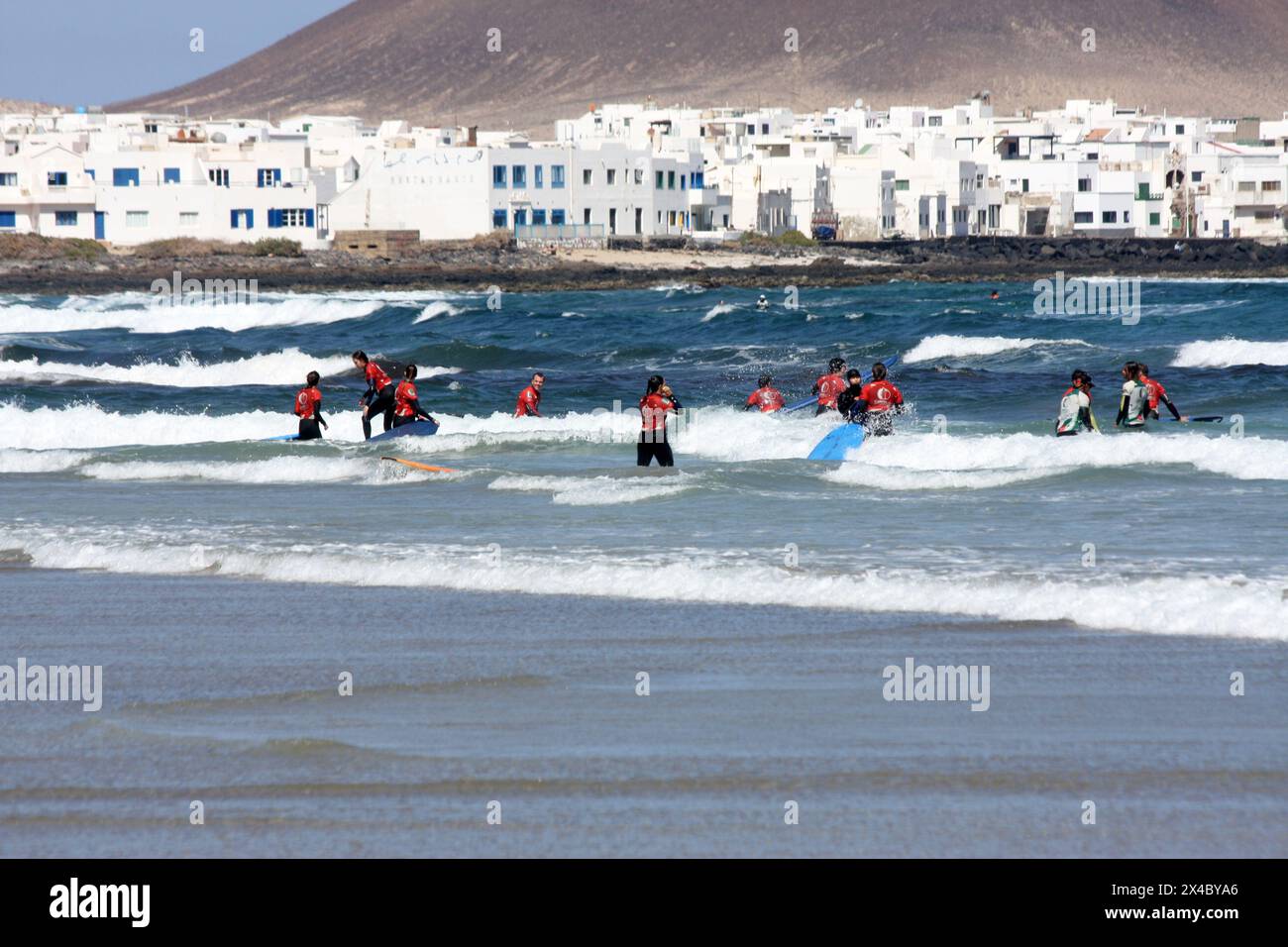 Surf schools on the beach at Famara Lanzarote Canary Islands Stock Photo