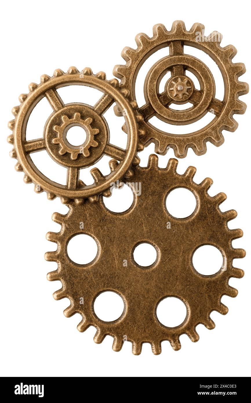 Group of aged bronze cogwheels, arranged as part of antique mechanism, isolated on white background. Ready to use design element. Stock Photo
