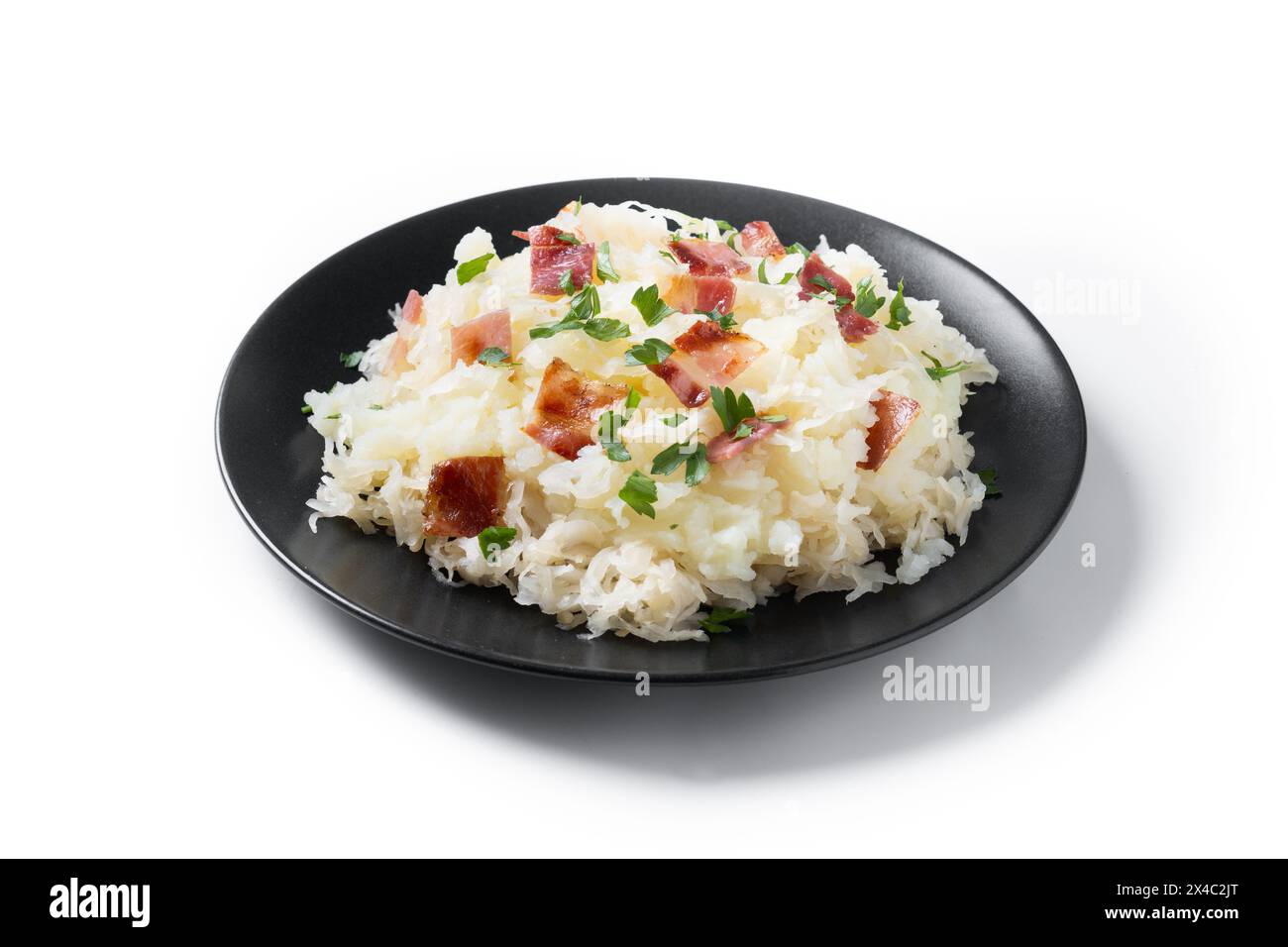 Slovak potato dumplings halusky with steamed sauerkraut and bacon