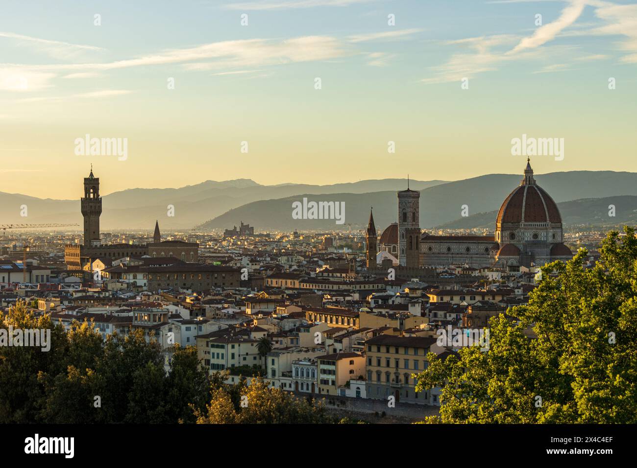 Classic view of Florence in Tuscany, Italy at sunset, with the Cathedral - Duomo and Palazzo Vecchio seen from Palazzo Michelangelo on a stunning day. Stock Photo