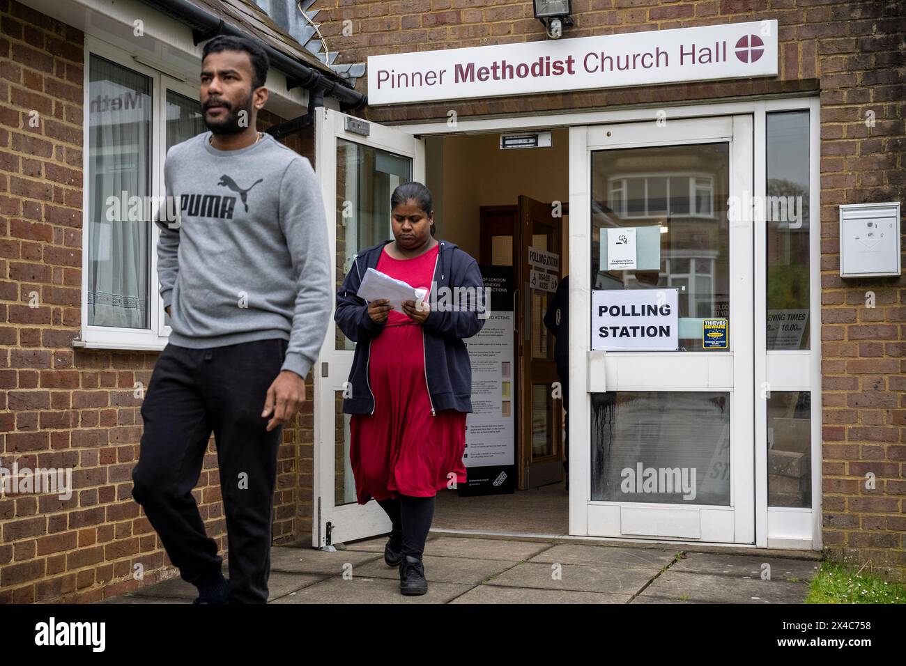 London, UK. 2 May 2024. Voters depart Pinner Methodist Church Hall, a