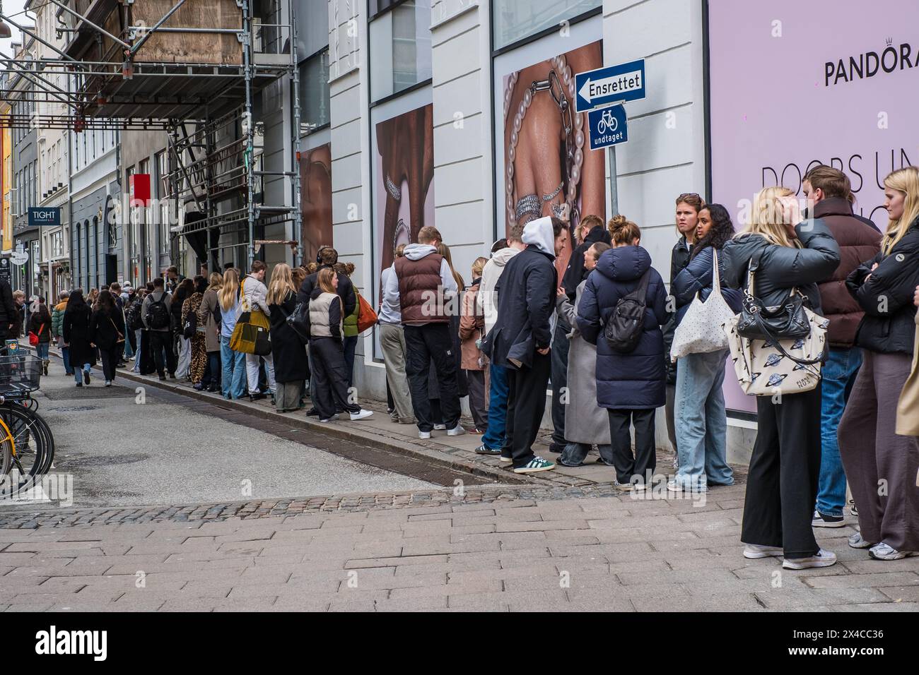 Copenhagen, Denmark - April 5, 2024: Young people queueing up on a street for Globe Studios pop up store. Stock Photo