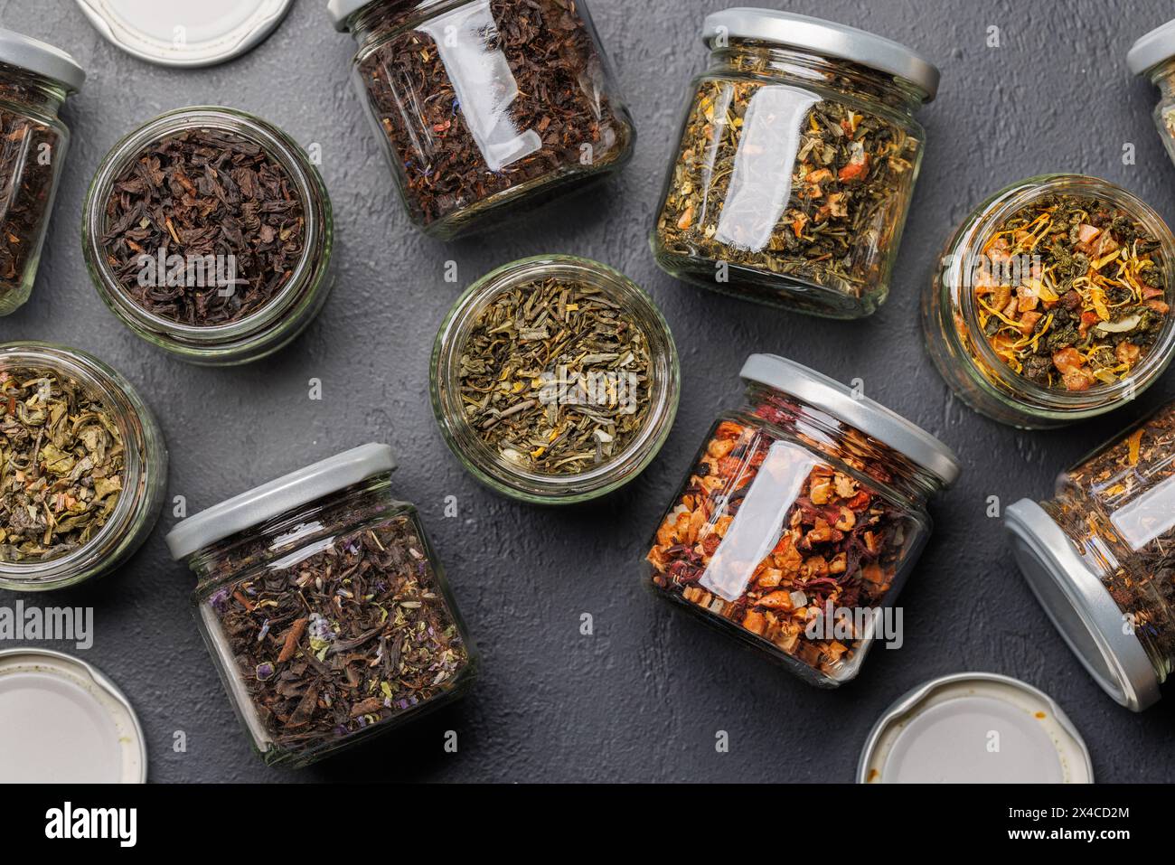 Tea time assortment: Various dry tea leaves. Flat lay Stock Photo