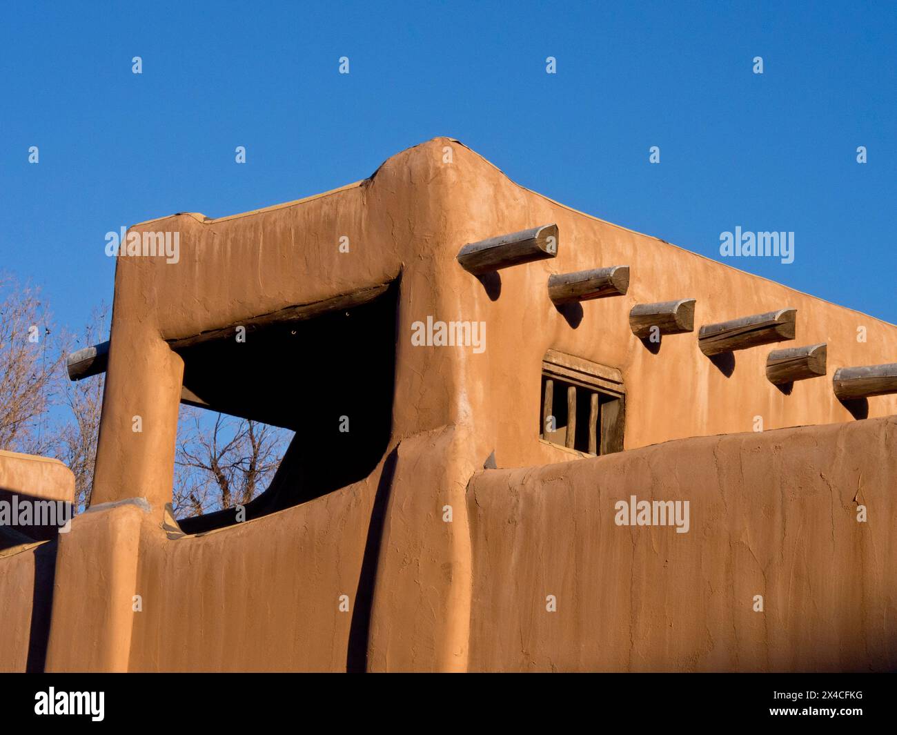 USA, New Mexico, Sante Fe. Southwest architecture, part of a earth colored adobe house in Santa Fe. Stock Photo