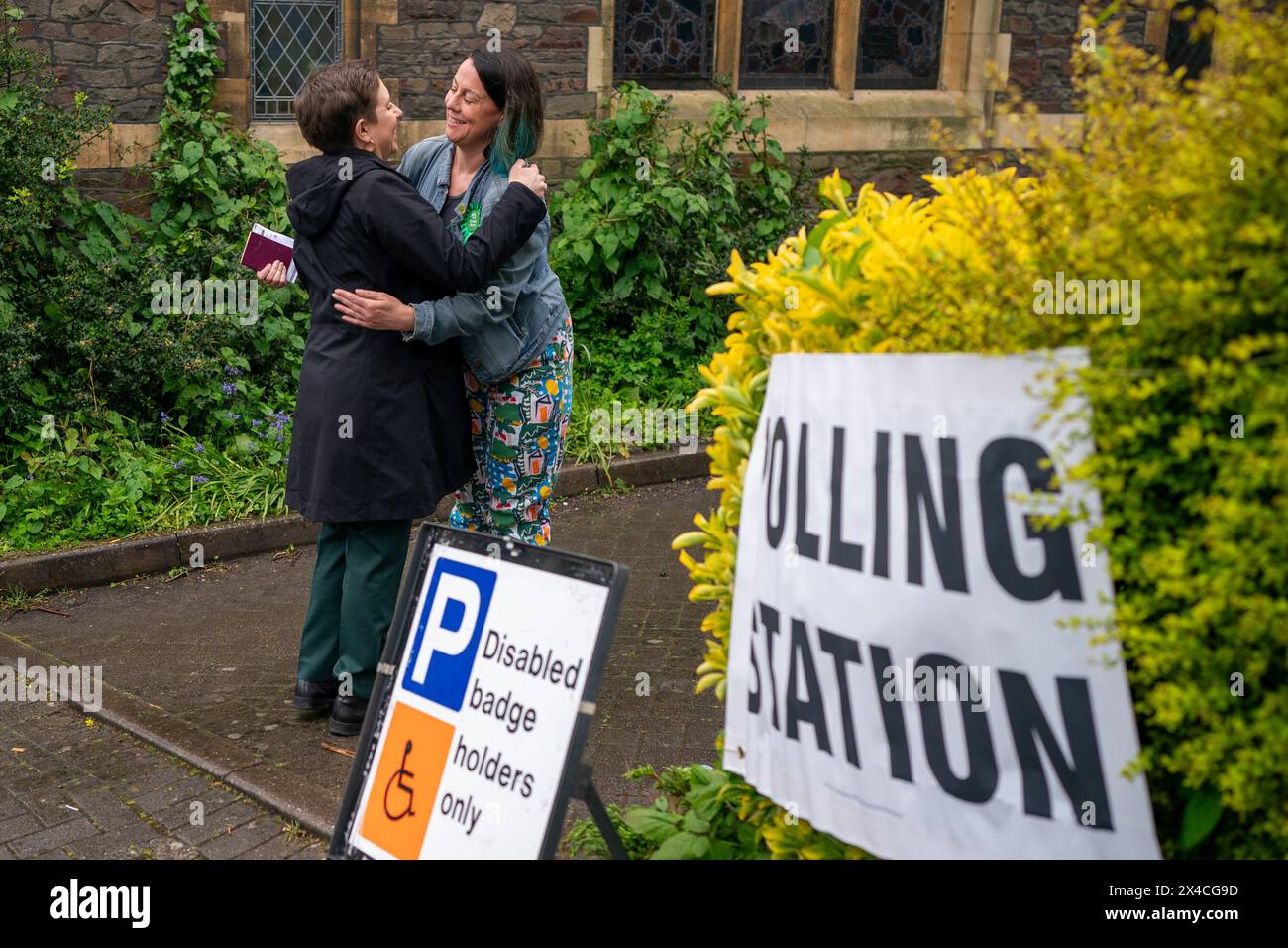 Green Party co-leader Carla Denyer hugs Green Group leader and Green Party candidate for Bishopston and Ashley Down, Emma Edwards, after casting her vote at a polling station in Bristol, in the local elections. Picture date: Thursday May 2, 2024. Stock Photo