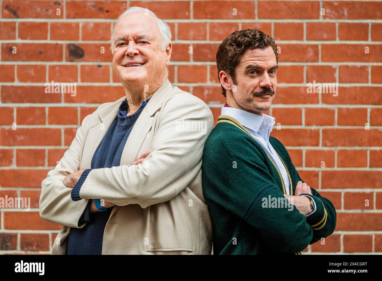 London, UK. 2nd May, 2024. John Cleese with Basil played by Adam JacksonSmith A preview of