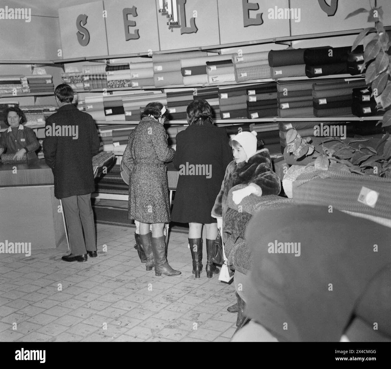 Socialist Republic of Romania in the 1970s. People inside a state-owned confections store. Stock Photo