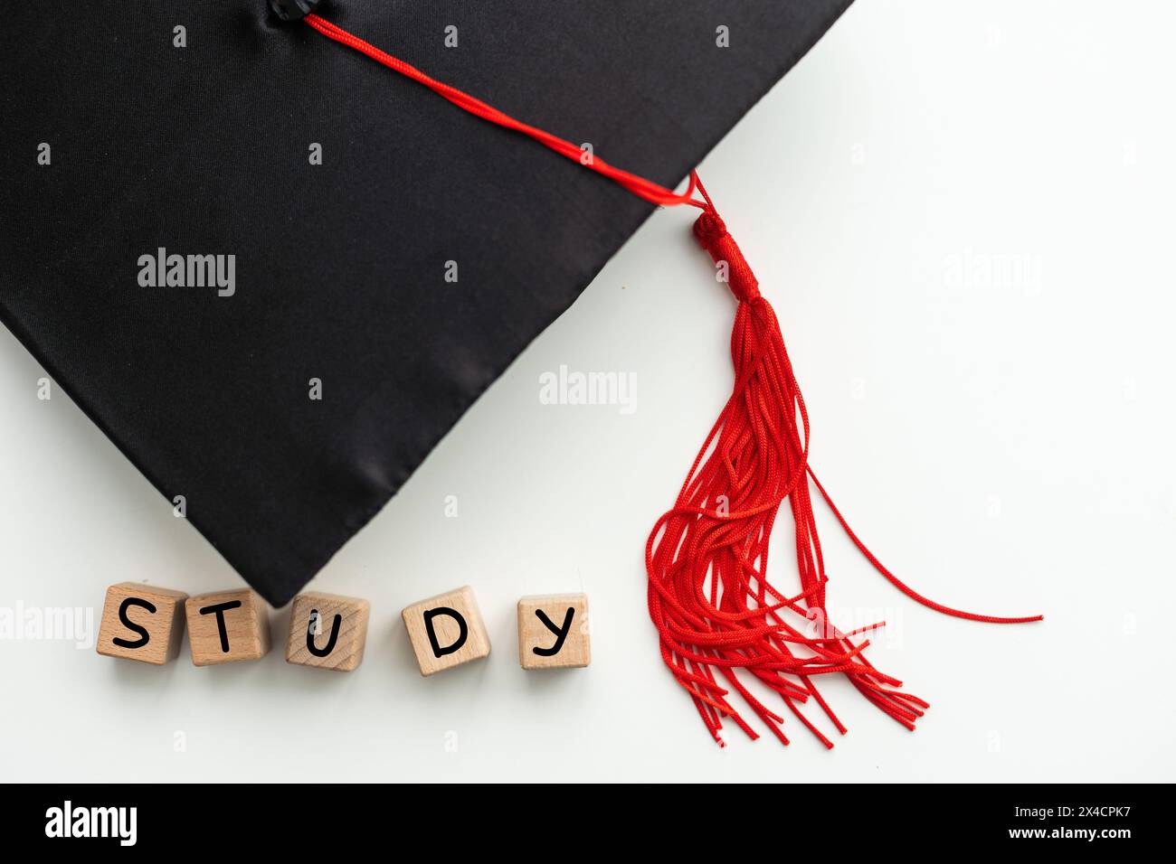 Graduation cap with red tassel isolated on white background Stock Photo ...