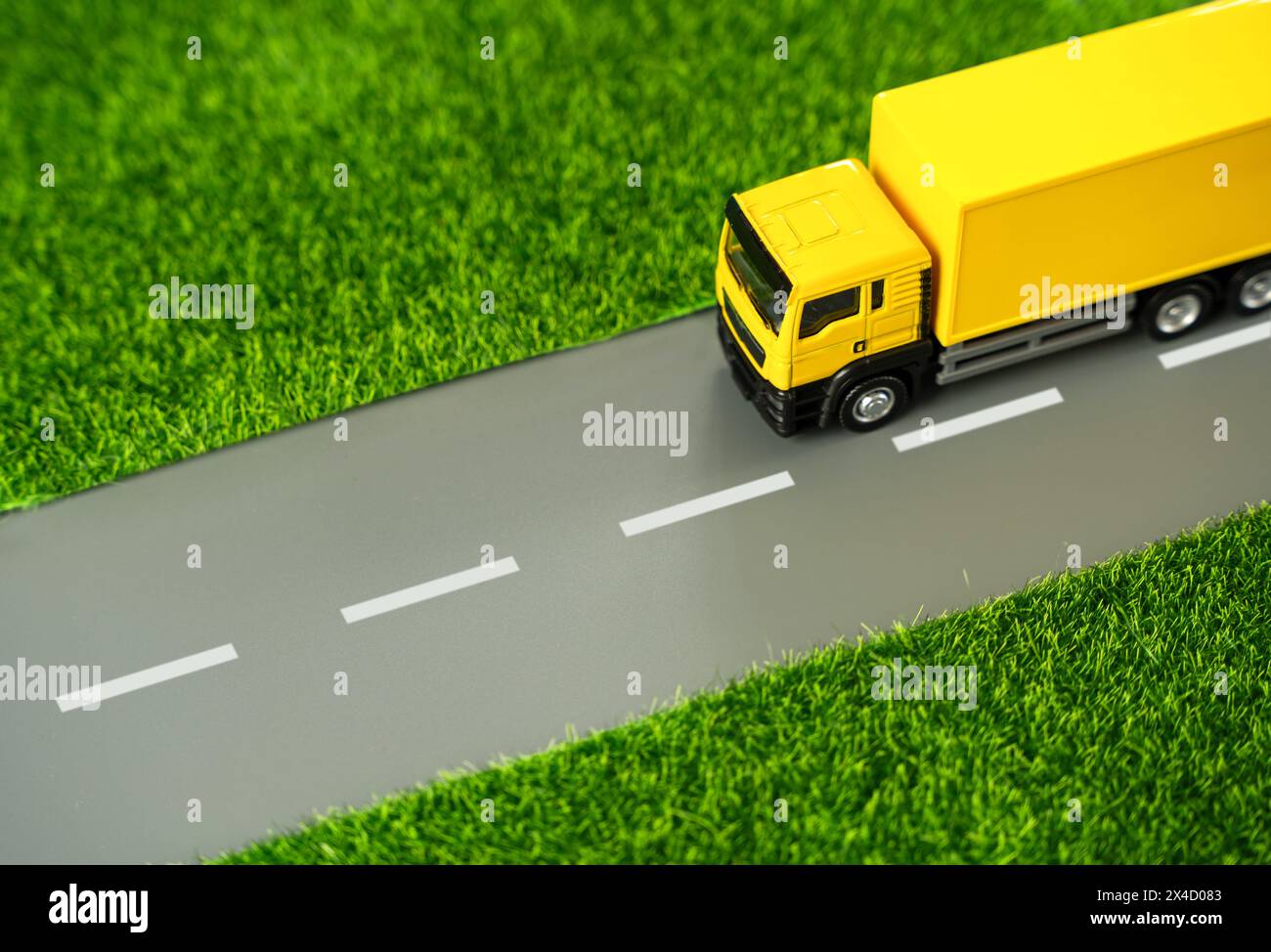 The truck is driving along the road. Logistics and industry. Delivery of online orders and purchases. Supply of goods. Stock Photo