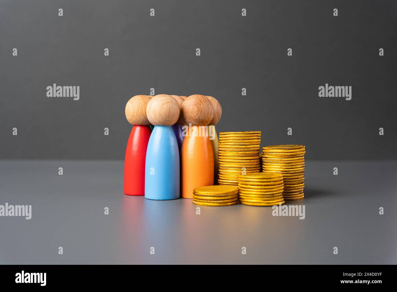 People and a stack of money coins. Salaries and pensions. Investment group. Invest in business and personnel development. Community social support. So Stock Photo