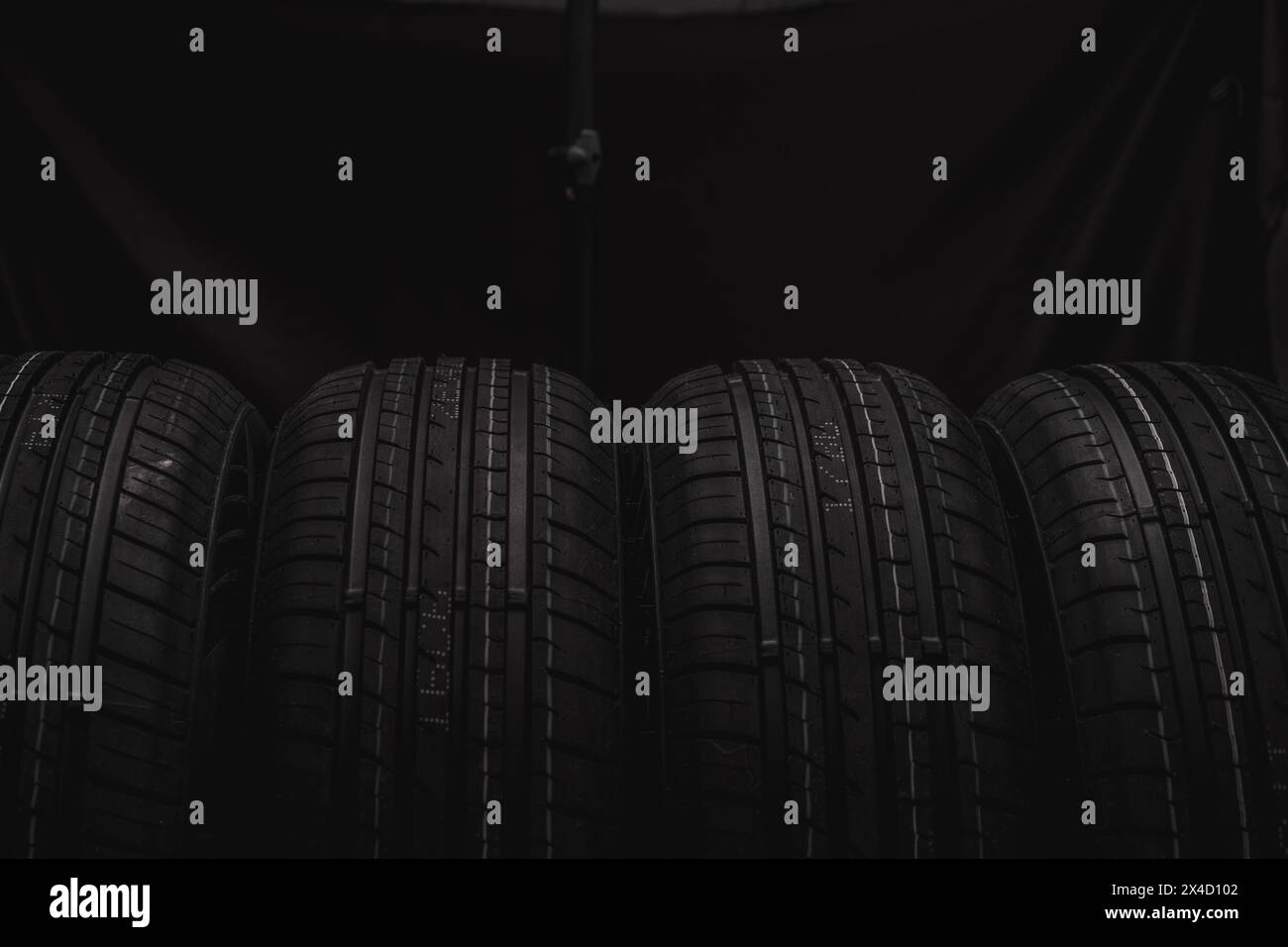 Car tires on a black background. Black tires on a black background Stock Photo