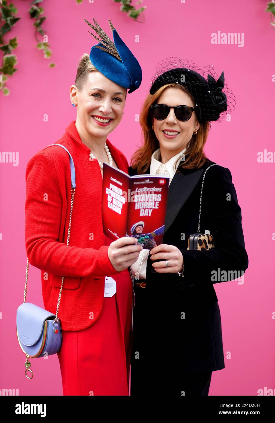 Racegoers Susan Salter and Sarah Ross pose for a photo as they arrive for day three of the Punchestown Festival at Punchestown Racecourse, County Kildare. Picture date: Thursday May 2, 2024. Stock Photo