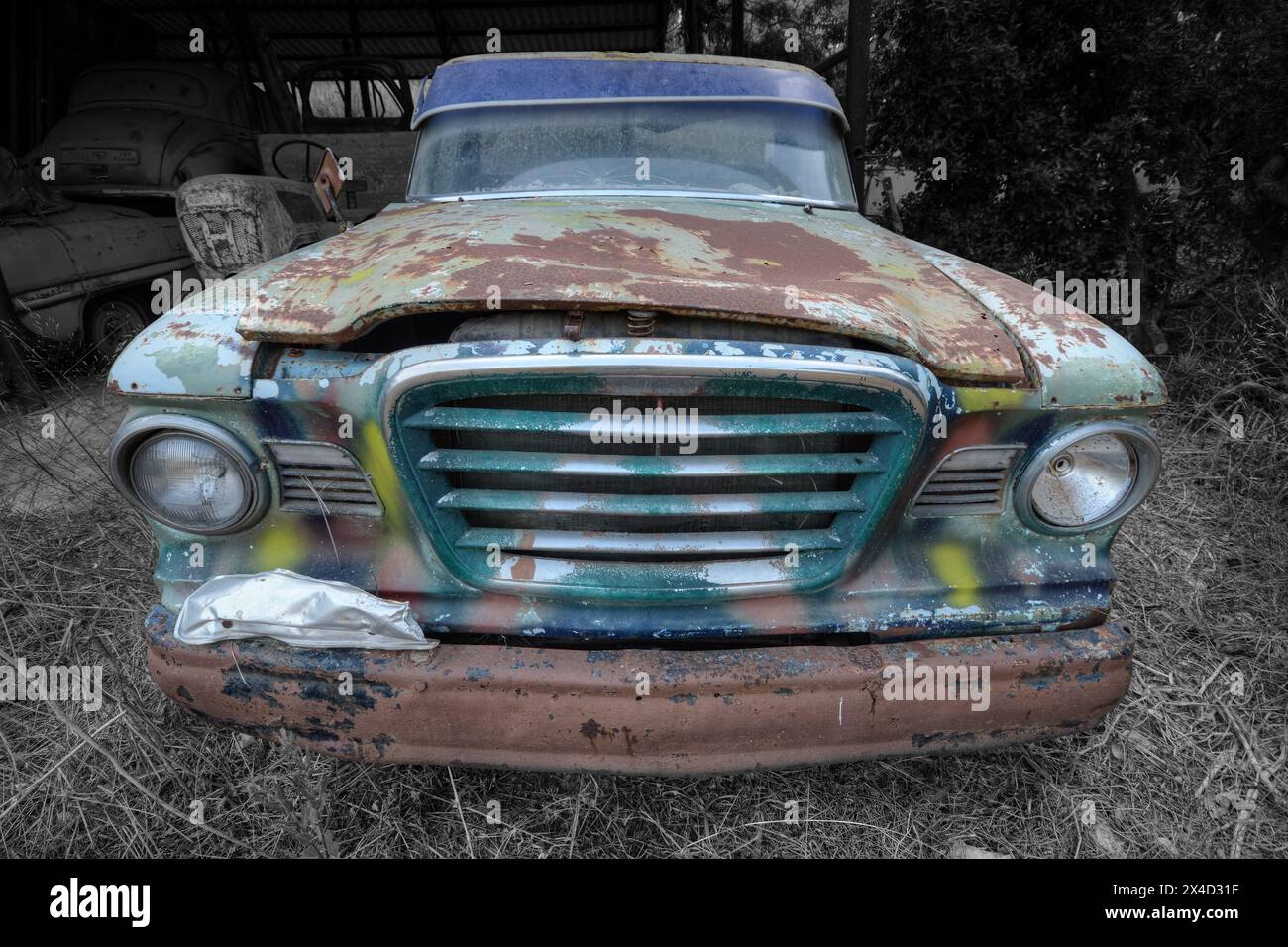 A frontal photo of an old rusty and abandoned American pick up truck Stock Photo