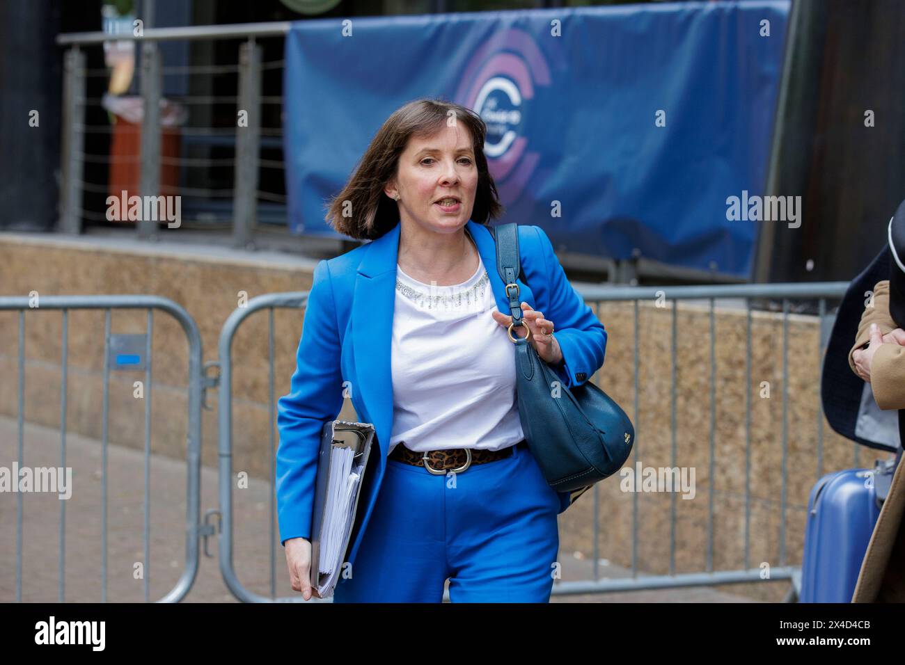 Dr Joanne McClean, Head of the Public Health Agency Northern Ireland (centre) leaves the Clayton Hotel in Belfast after giving evidence at the UK Covid-19 inquiry hearing. Picture date: Thursday May 2, 2024. Stock Photo