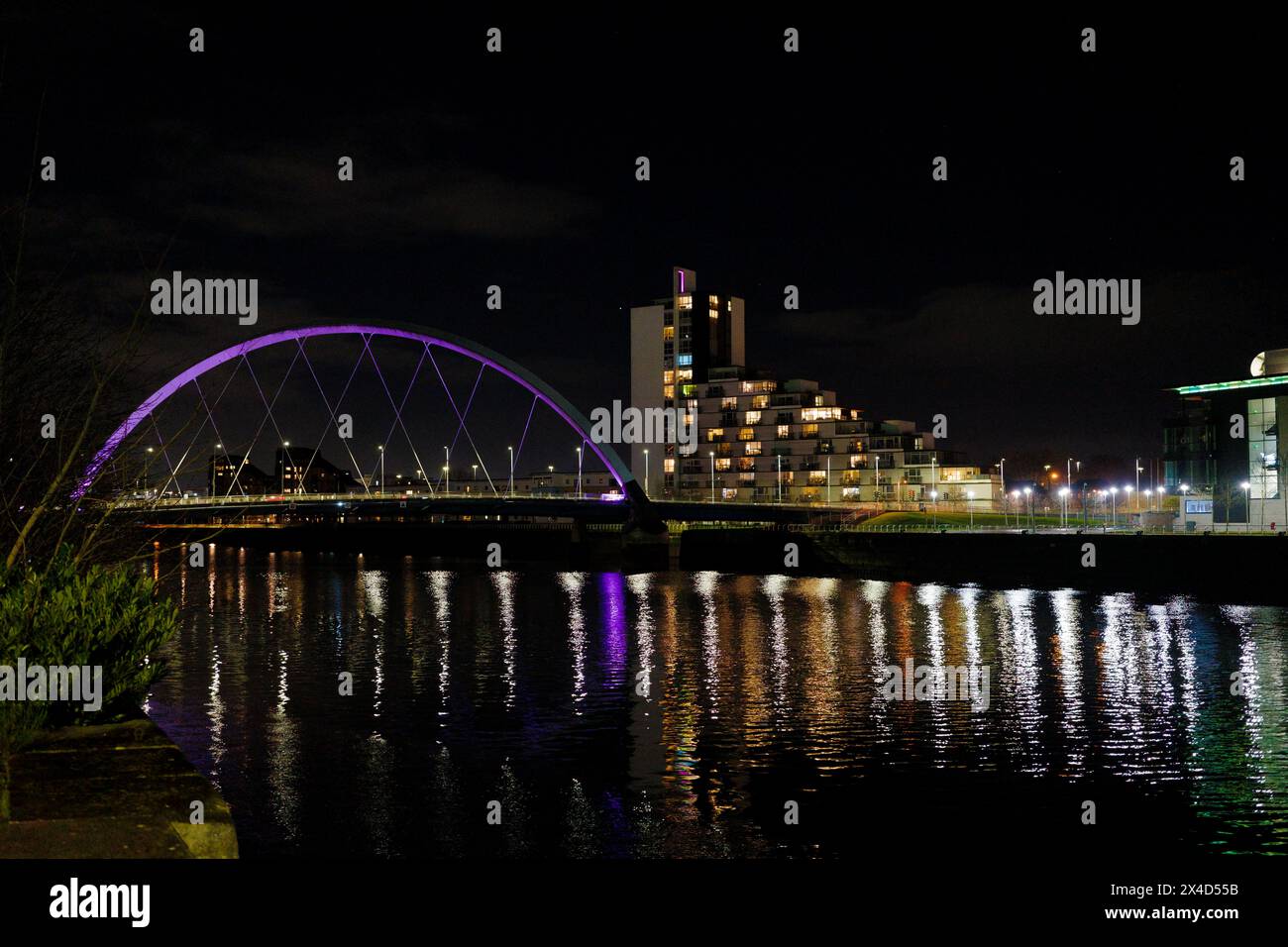 Glasgow Scotland: 11th Feb 2024: The Clyde Arc illuminated at night on the Banks of the River Clyde aka the Squinty Bridge Stock Photo