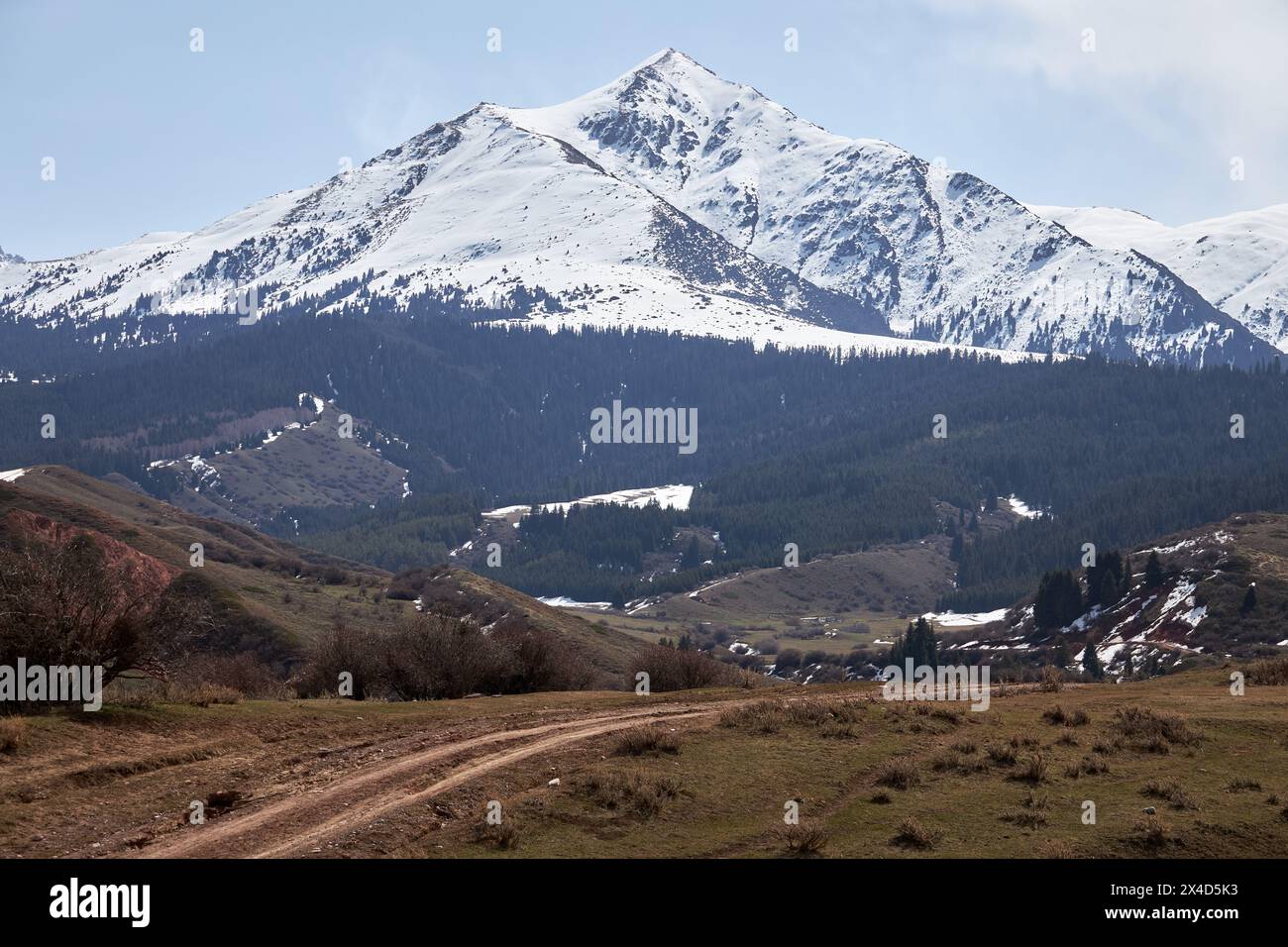 Majestic Snow-Capped triangular mountain and Countryside Road. Natural ...