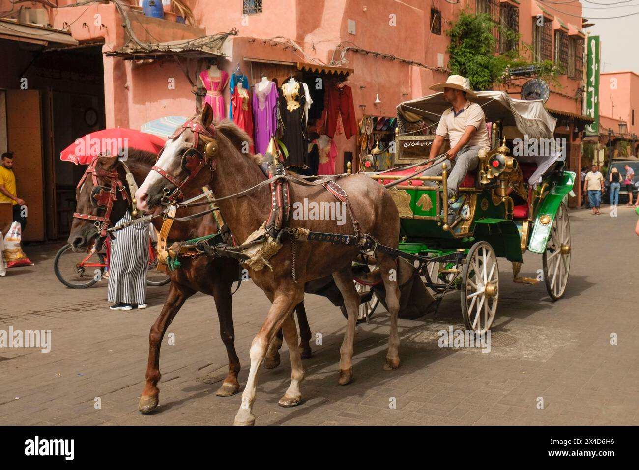 Marrakech, Morocco. Local provides a horse drawn carriage ride for tourists around the medina. (Editorial Use Only) Stock Photo