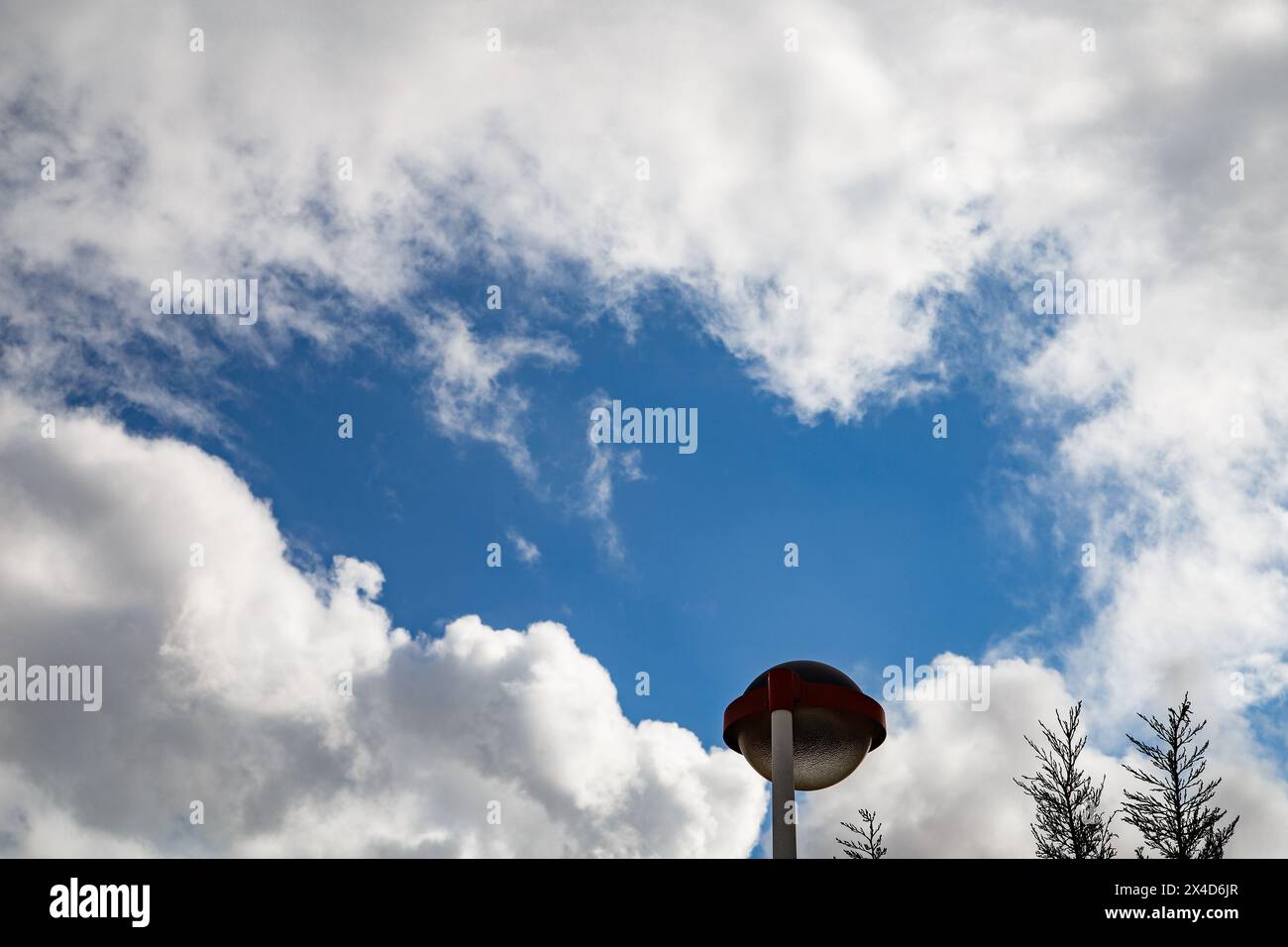 Street lamp with clouds in Els Poblets Stock Photo