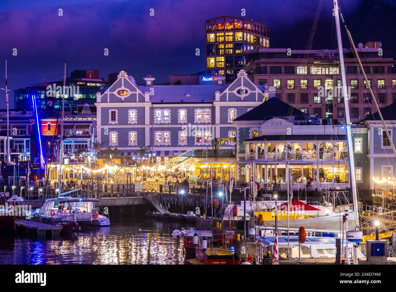 South Africa, Cape Town. Boats in harbor and city nightlife Stock Photo