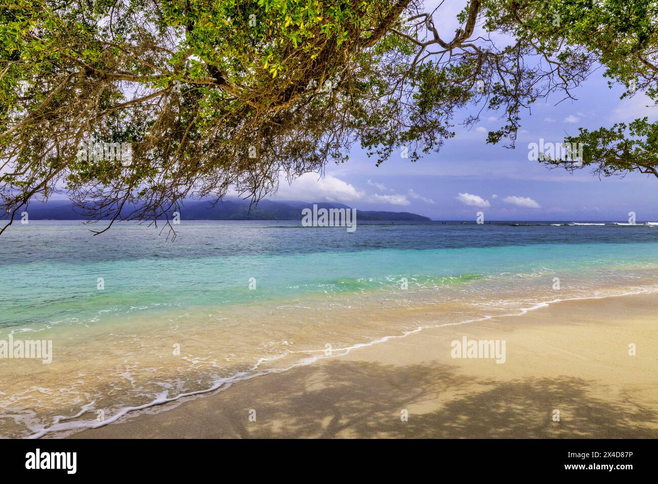 Gili Trawangan Island off the coast of Lombok, Indonesia. White sand, clear warm water with a laid back tropical atmosphere. Stock Photo